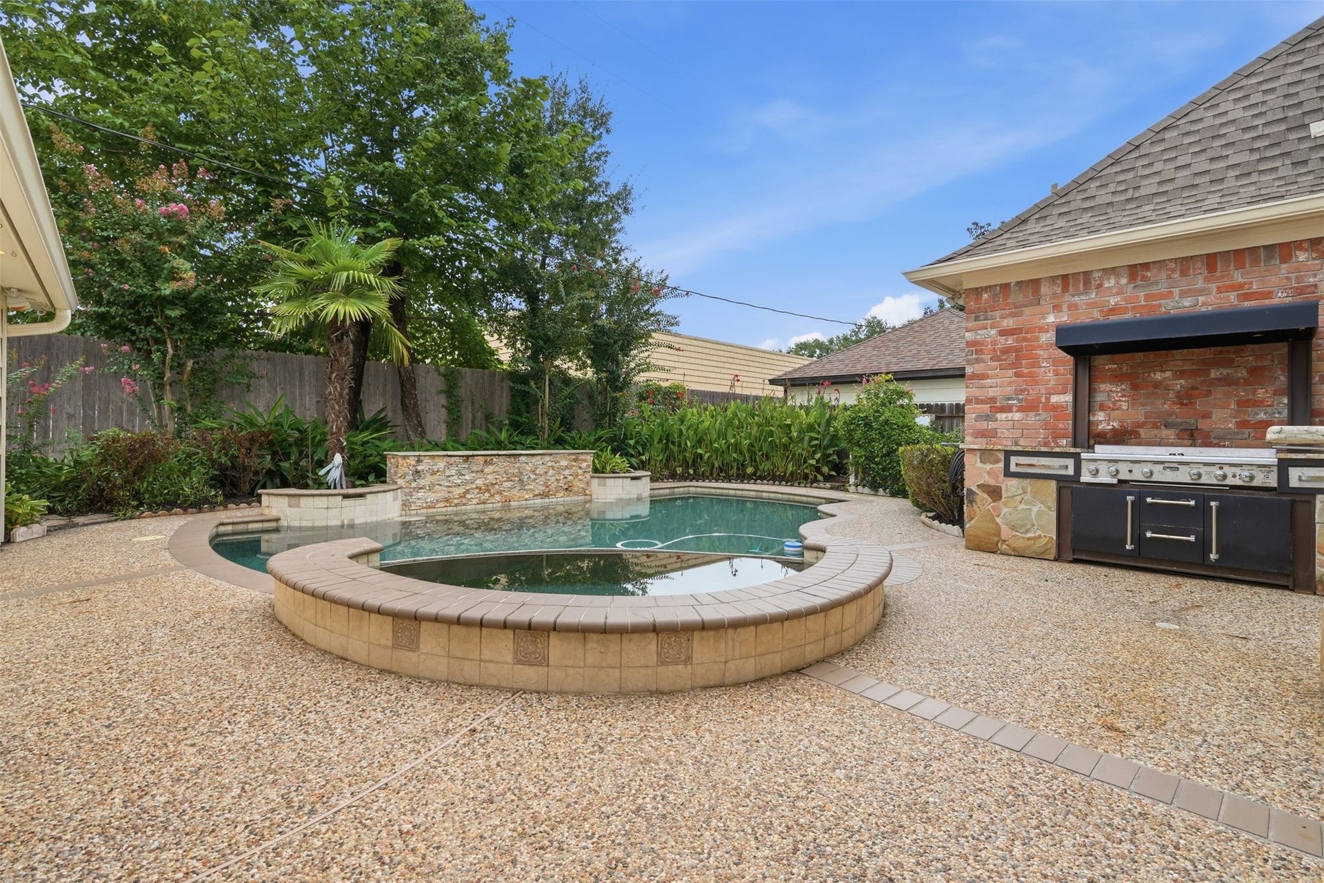 The beautifully designed backyard offers the perfect combination of recreation, relaxation, and privacy.