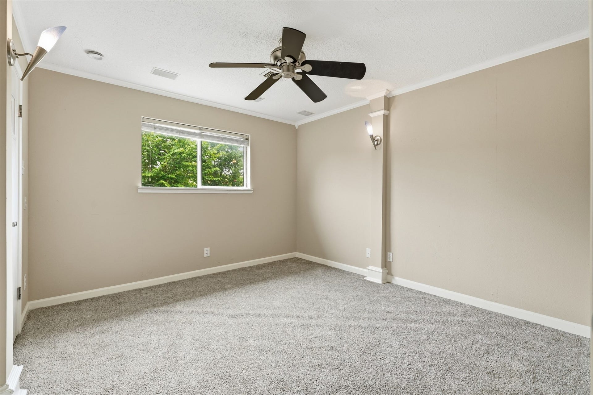 Bright and spacious secondary bedroom offers flexibility for family, guests or a home office.