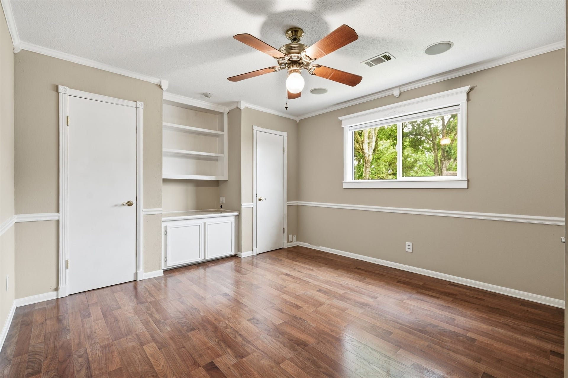 Well-appointed secondary bedroom featuring a clean, functional design for family and friends.