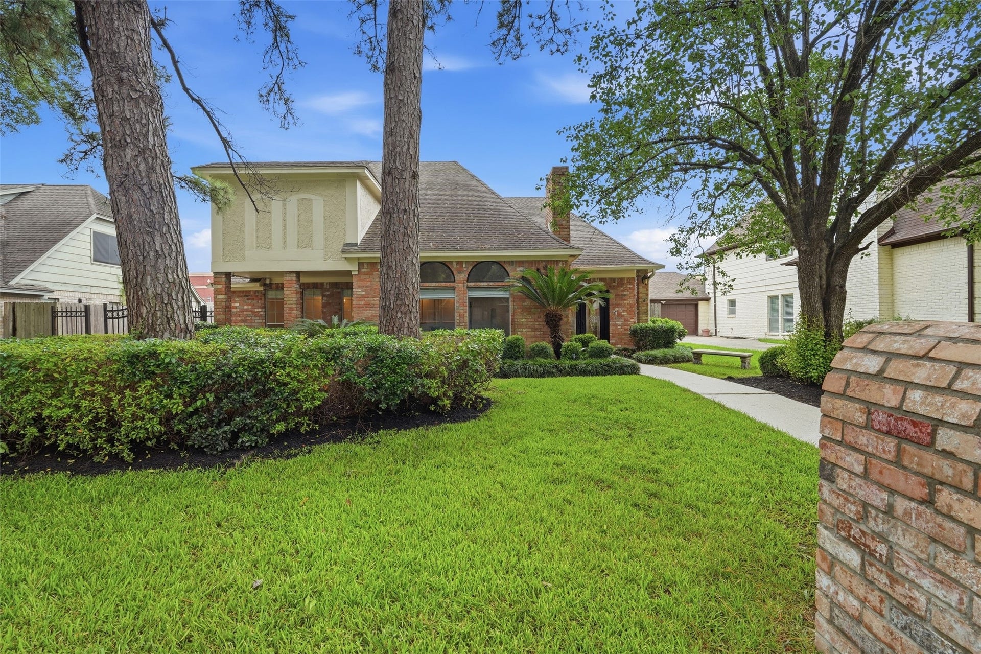 Beautifully maintained exterior showcasing attractive architectural details and a welcoming front entry.