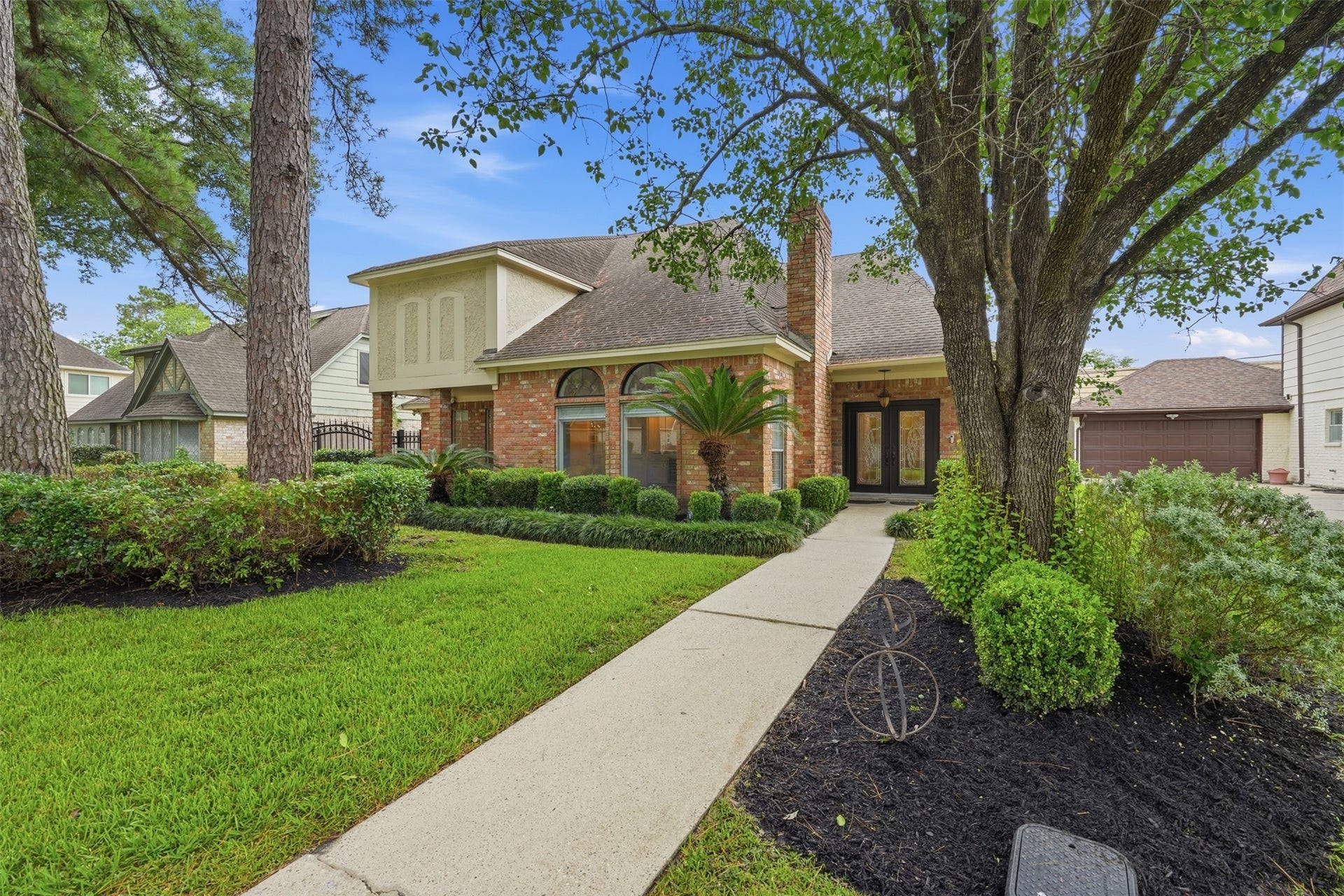 Welcome to 8310 Mentmore Drive, where timeless curb appeal, mature landscaping, and an inviting front elevation creates a memorable first impression.