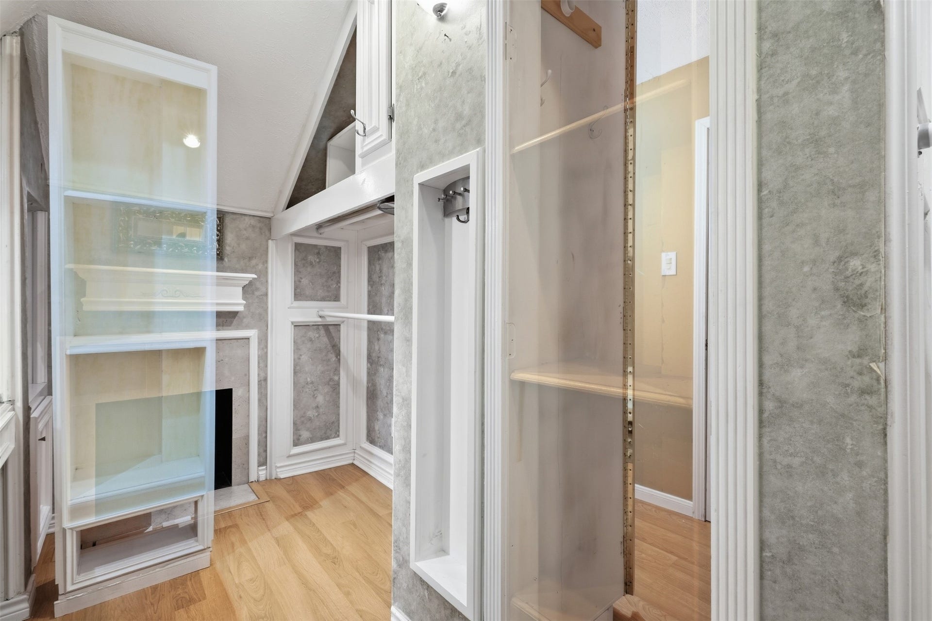 This expansive walk-in closet provides abundant hanging space, shelving, and room for every wardrobe.
