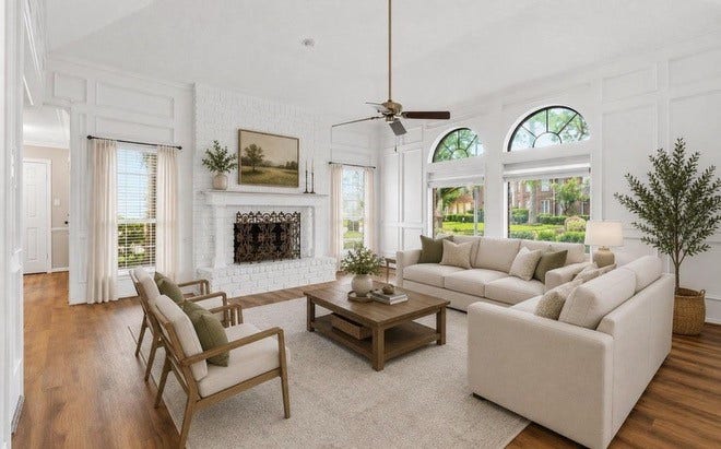 This is a view of the living room virtually staged with furniture to give the tenant a visual idea for the space.