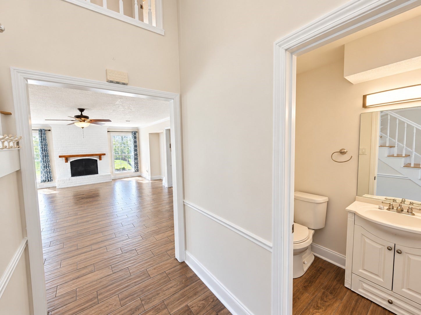 Dowonstairs half bath leading into the family room