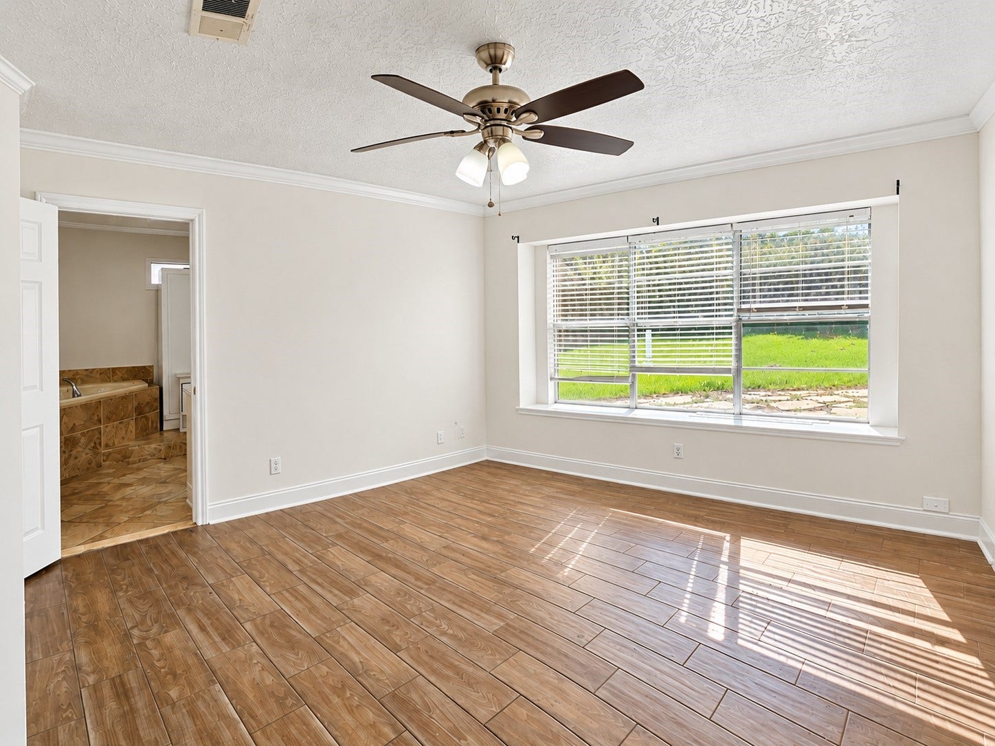 Large primary bedroom with plenty of natural light and large en suite!