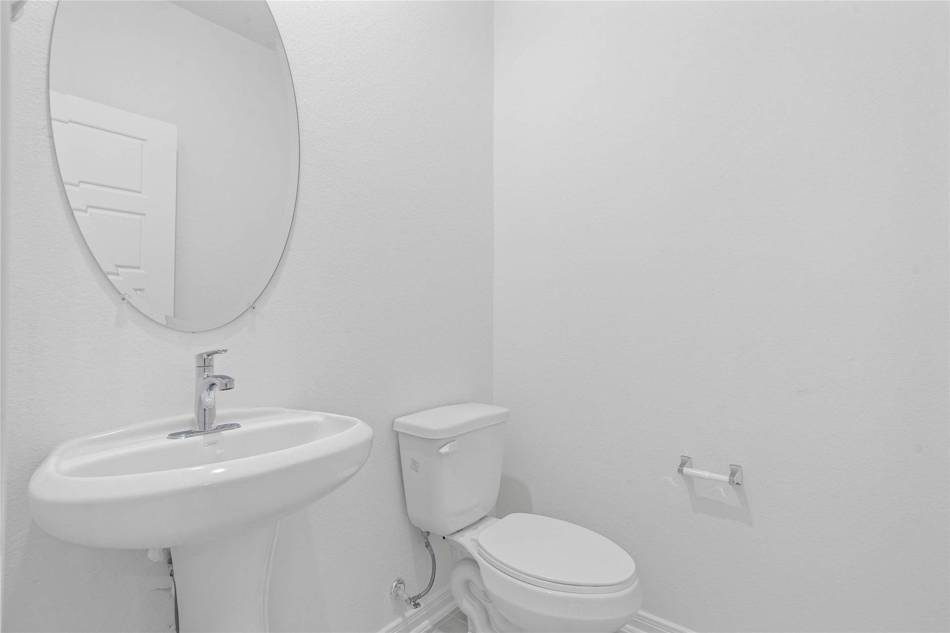 5623 Blackbird Lane, Hitchcock, TX 77563 The convenient half bath features clean, neutral finishes and Dune colored tile flooring, creating a polished and practical space for guests.