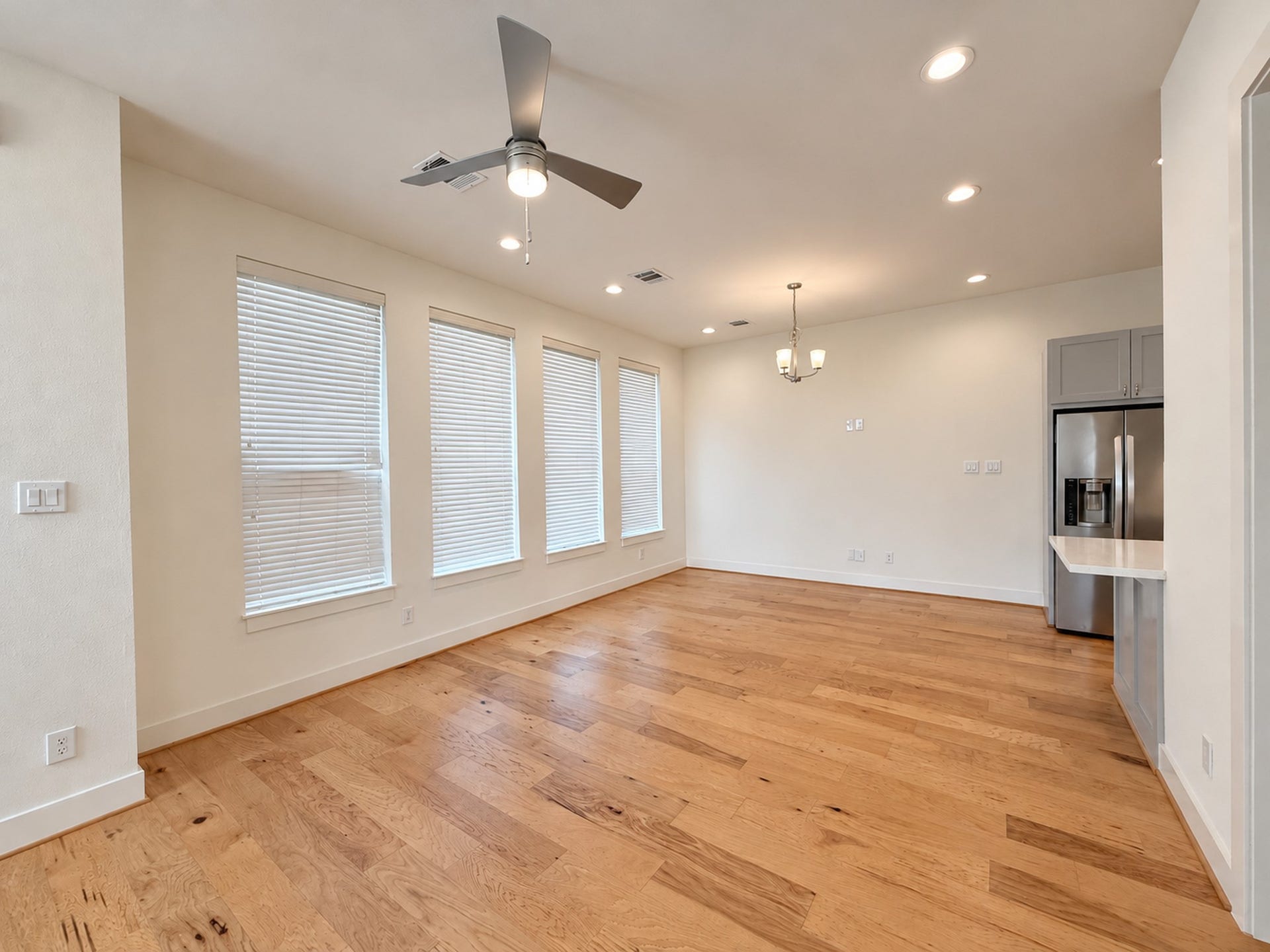2906 Cline Street, Houston, TX 77020 Bright, open living room featuring wood floors, abundant windows, and seamless flow into the kitchen and dining area.
