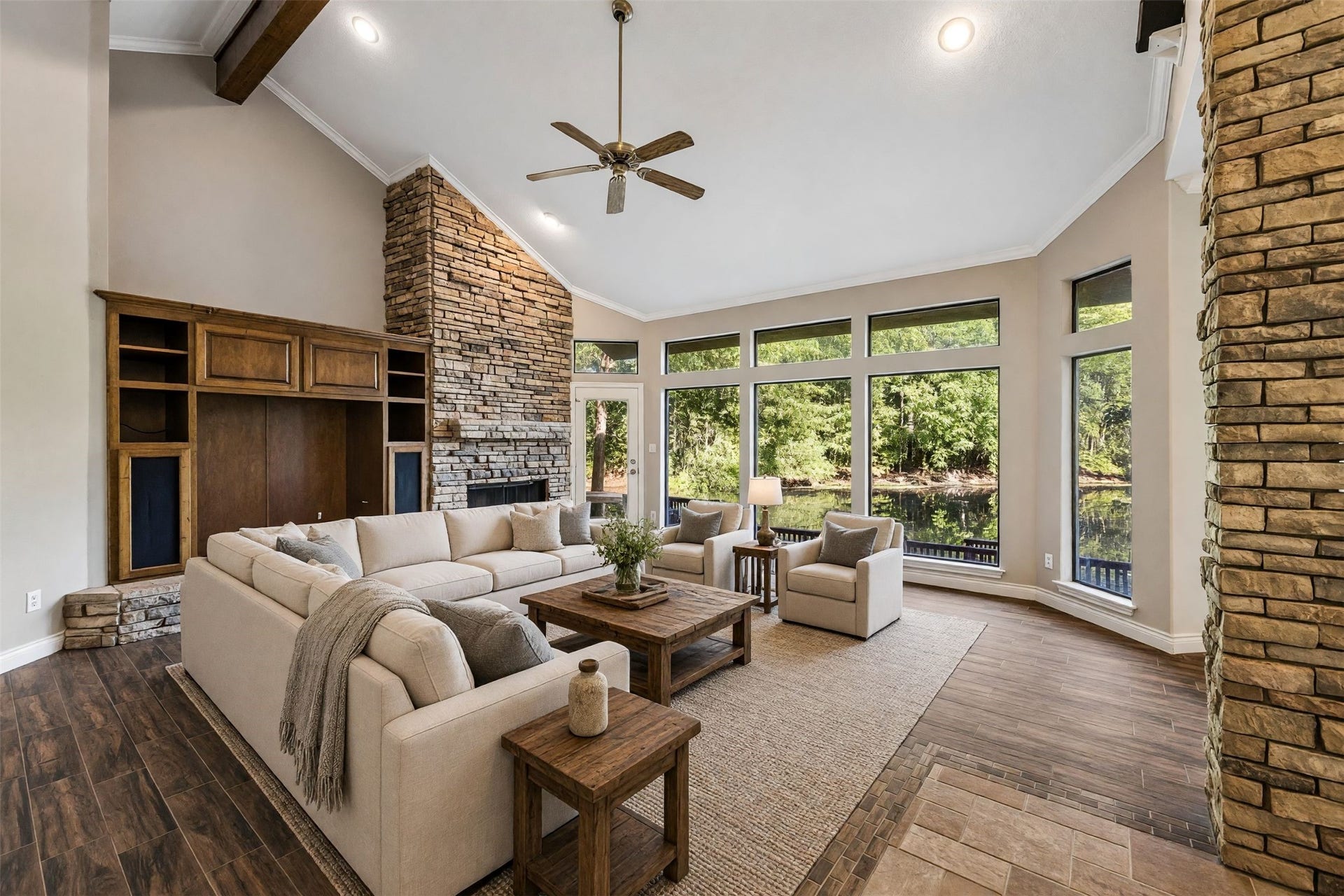424 Nursery Road, Spring, TX 77380 Grand family room with stone fireplace, soaring ceilings and a full view of the outdoors. *virtually staged