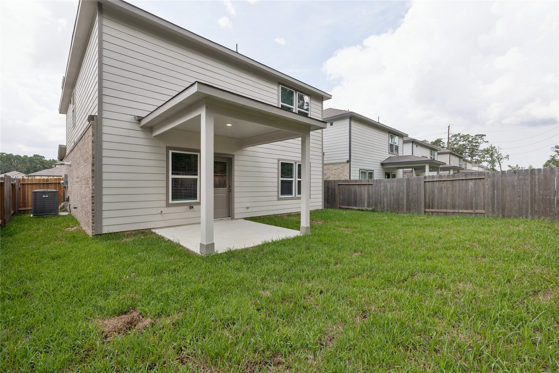 7806 Bergamot Cir, Magnolia, TX 77354 Enjoy ultimate privacy and tranquility in this charming home with no back neighbors, featuring a spacious backyard perfect for relaxation or entertaining.