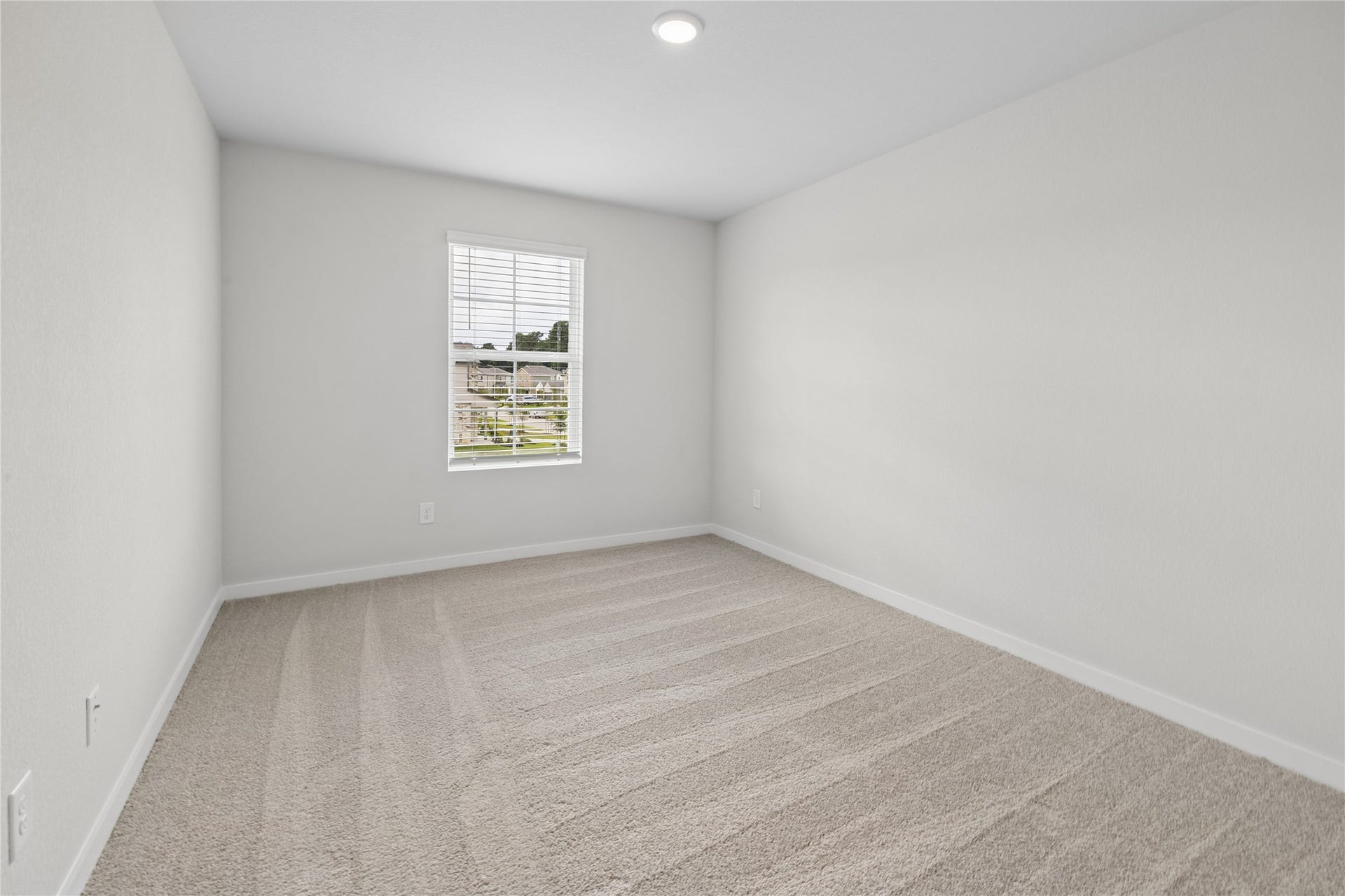7806 Bergamot Cir, Magnolia, TX 77354 Bright and inviting bedroom with soft carpeting and a large window providing natural light.