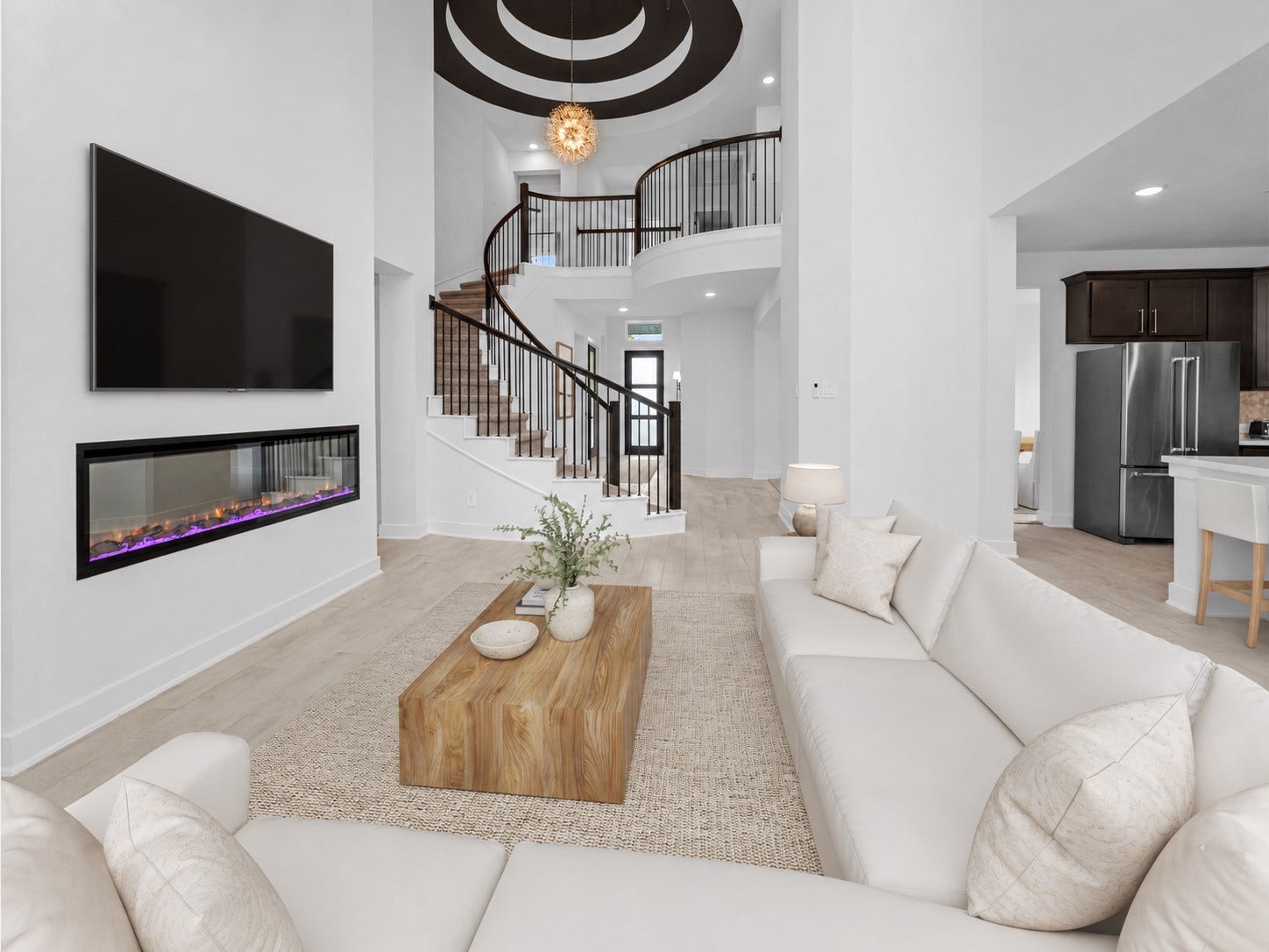 Living space is anchored by a warm fireplace and designed for gathering.