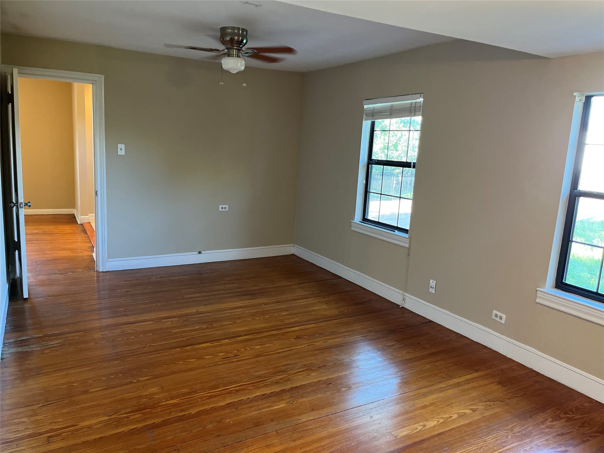 2115 Holman Street, Houston, TX 77004 Bedroom #2 is generously sized with an abundance of natural light, closet space, and ceiling fan.