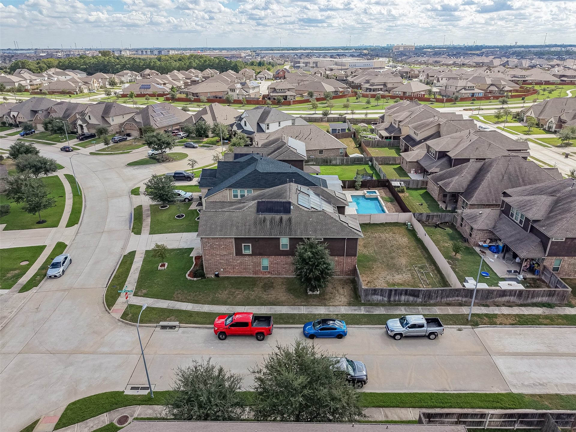 2826 Verdant Spring Trail, Katy, TX 77493 Spacious suburban neighborhood with well-maintained homes, featuring a property with a sizable backyard and private pool, perfect for family living.