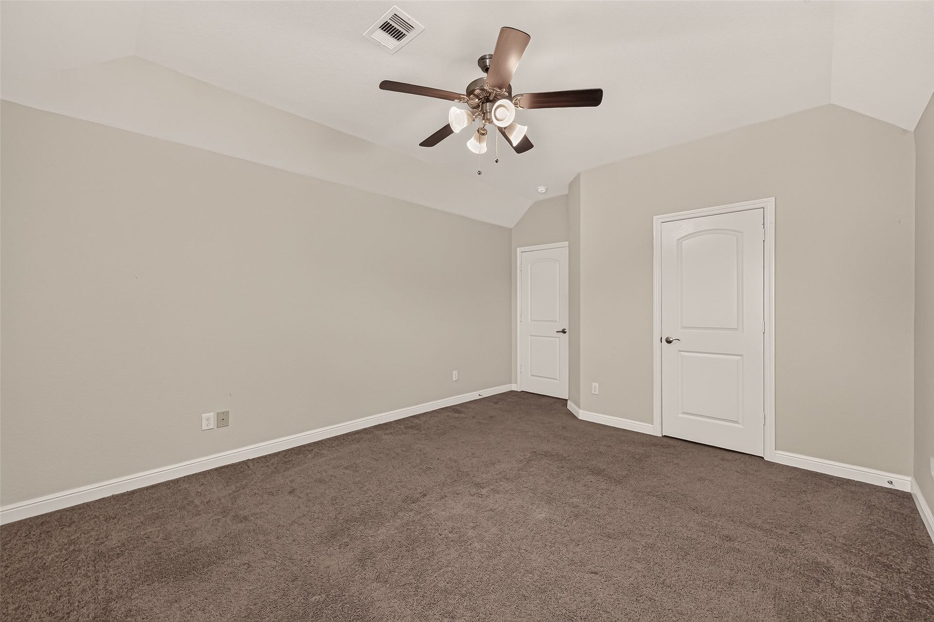 2826 Verdant Spring Trail, Katy, TX 77493 Spacious bedroom with neutrSpacious third bedroom with plush carpeting, neutral tones, a ceiling fan, abundant natural light, and dual closets.al walls, plush carpeting, and a stylish ceiling fan, offering comfort and modern elegance.