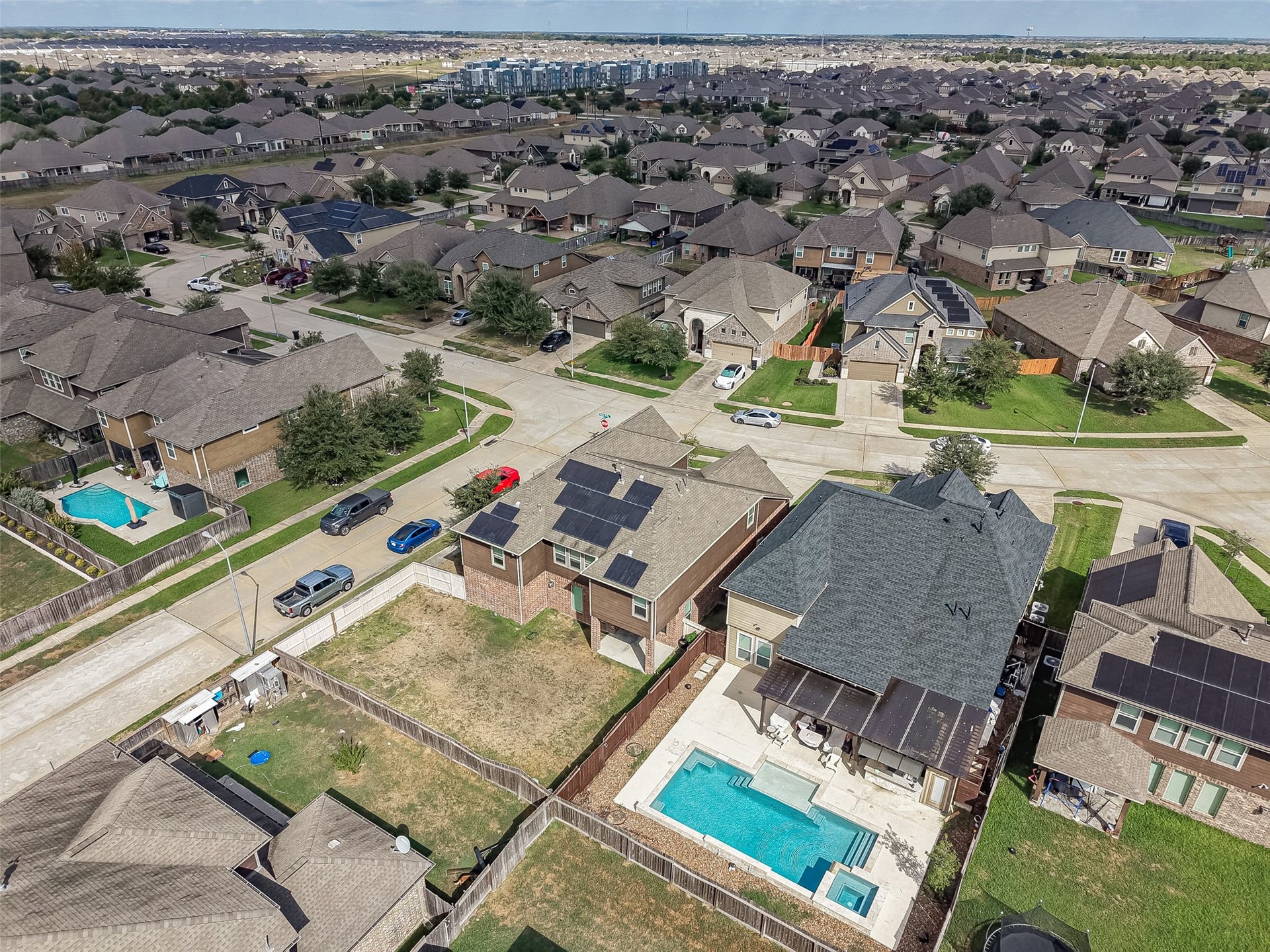 2826 Verdant Spring Trail, Katy, TX 77493 Nestled in a vibrant neighborhood, this home boasts a spacious backyard with a sparkling pool, perfect for relaxation and entertaining. Solar panels enhance energy efficiency, while the surrounding community offers a serene suburban atmosphere.