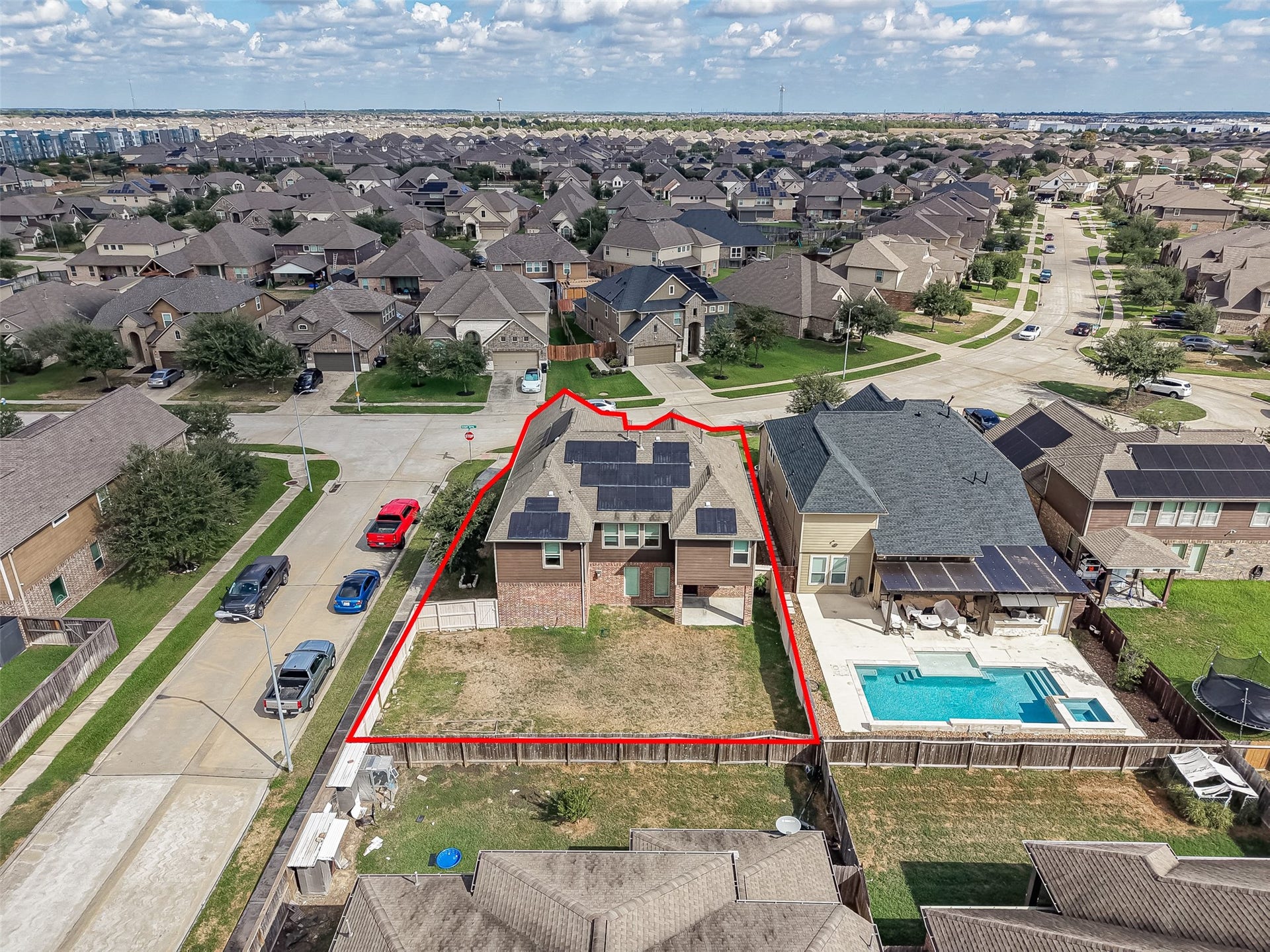 2826 Verdant Spring Trail, Katy, TX 77493 Spacious two-story home with solar panels, situated in a vibrant neighborhood, featuring a generous backyard for outdoor activities.
