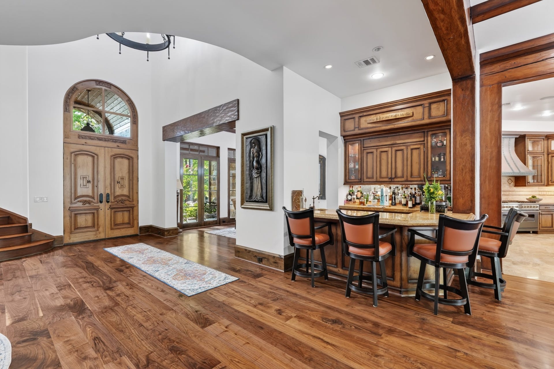 247 S Fazio Way, Spring, TX 77389 A beautifully appointed wet bar with custom wood cabinetry creates the perfect gathering space, just steps from the chef's kitchen and main living areas.