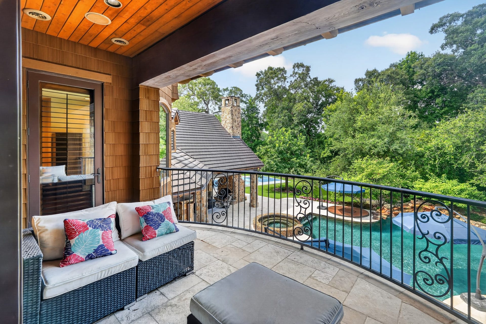 247 S Fazio Way, Spring, TX 77389 Private covered patio with overlooking the pool, spa, and beautifully wooded grounds.