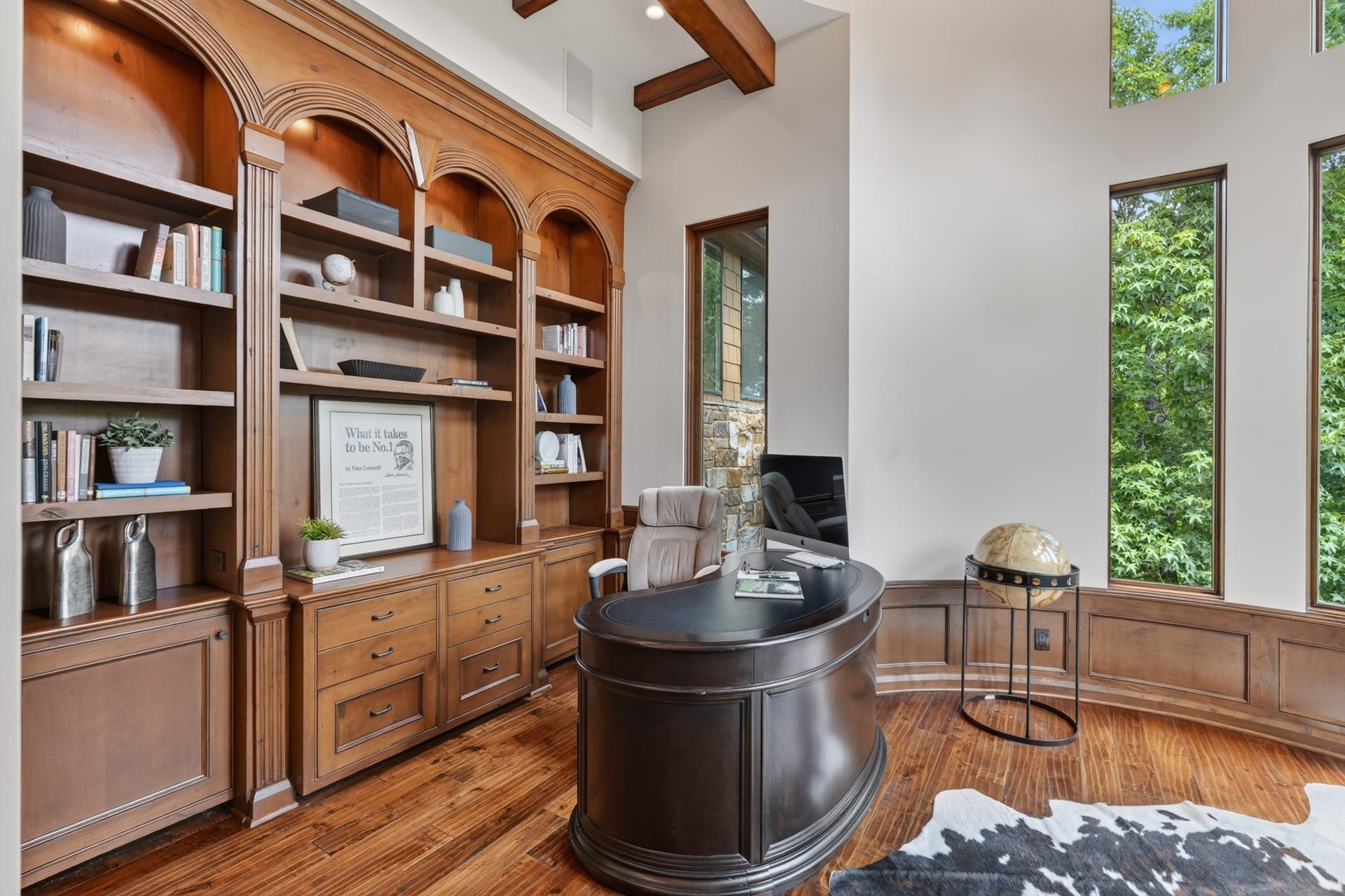 247 S Fazio Way, Spring, TX 77389 Private executive office designed with custom library-style built-ins, elegant millwork, and expansive windows providing ample natural light and privacy.