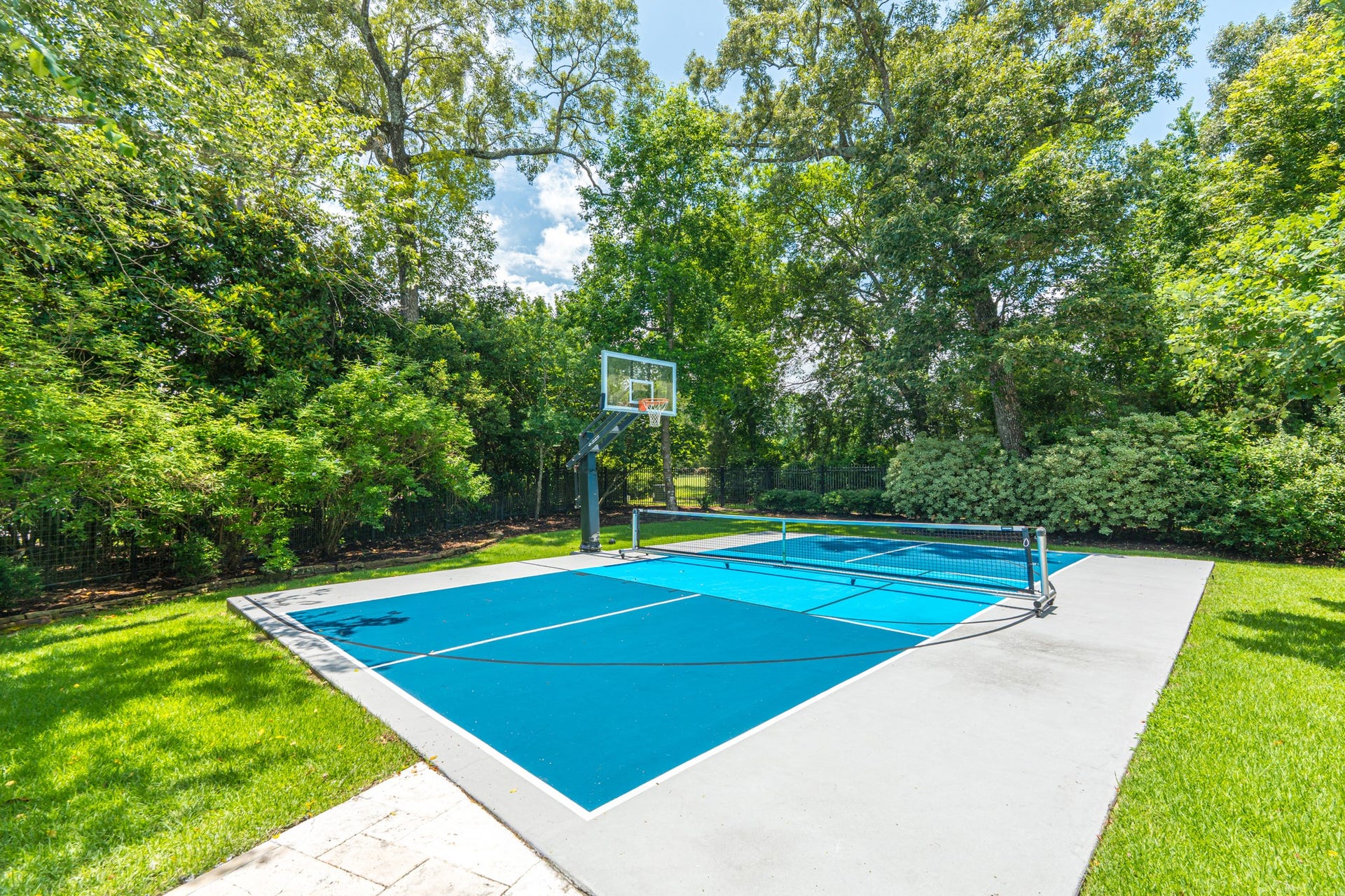 247 S Fazio Way, Spring, TX 77389 An exceptional amenity, the sports court offers the perfect setting for recreation and year-round enjoyment.