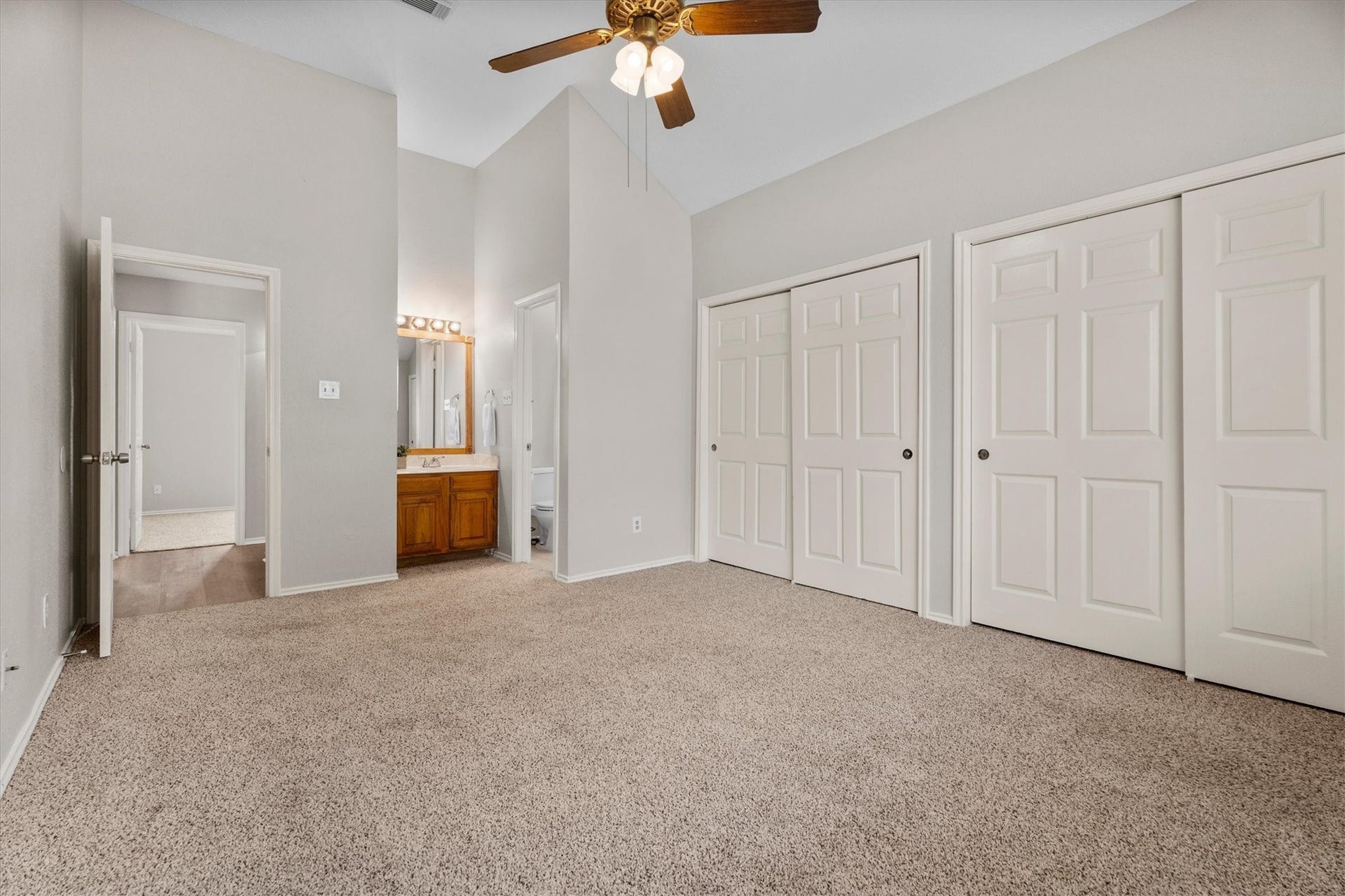 Multiple closets offer added storage, while the adjoining bath provides everyday convenience.
