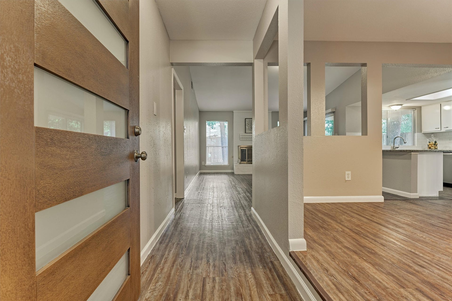 26 W Broken Oak Court, The Woodlands, TX 77381 Step inside where you will find vinyl flooring throughout the main living areas. The dining room is on the right.