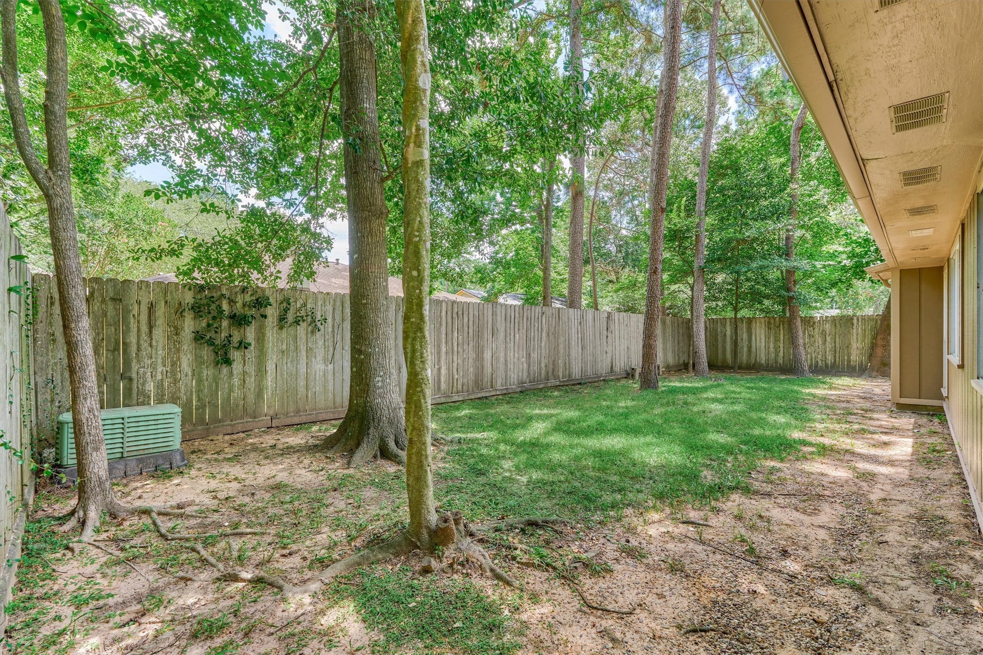 26 W Broken Oak Court, The Woodlands, TX 77381 The back yard is spacious enough for play equipment and the family pets!