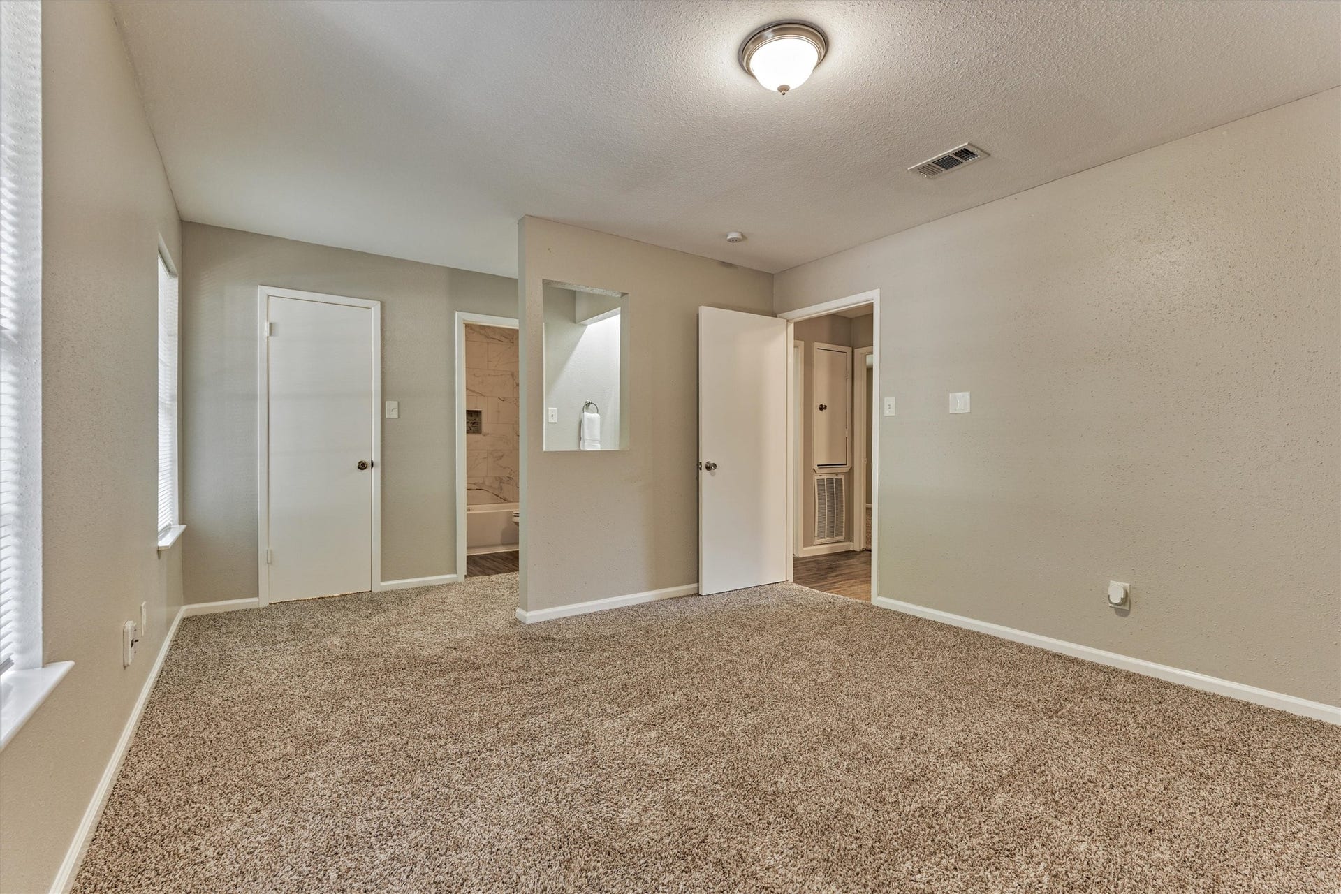 26 W Broken Oak Court, The Woodlands, TX 77381 Another view of the primary bedroom which is spacious enough for a king size bed.