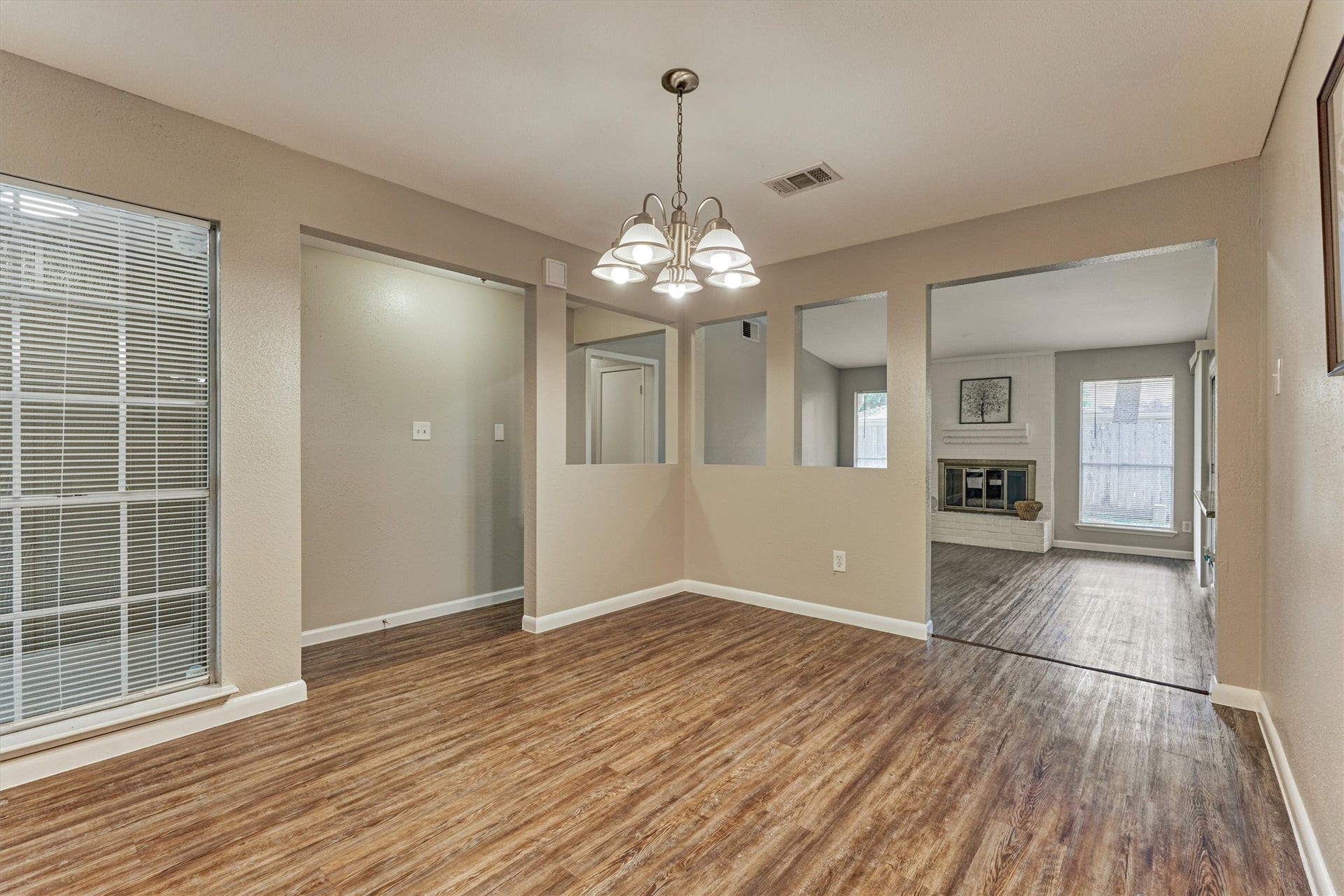 26 W Broken Oak Court, The Woodlands, TX 77381 This view highlights the open concept within the living areas. Updated light fixtures are throughout the home.