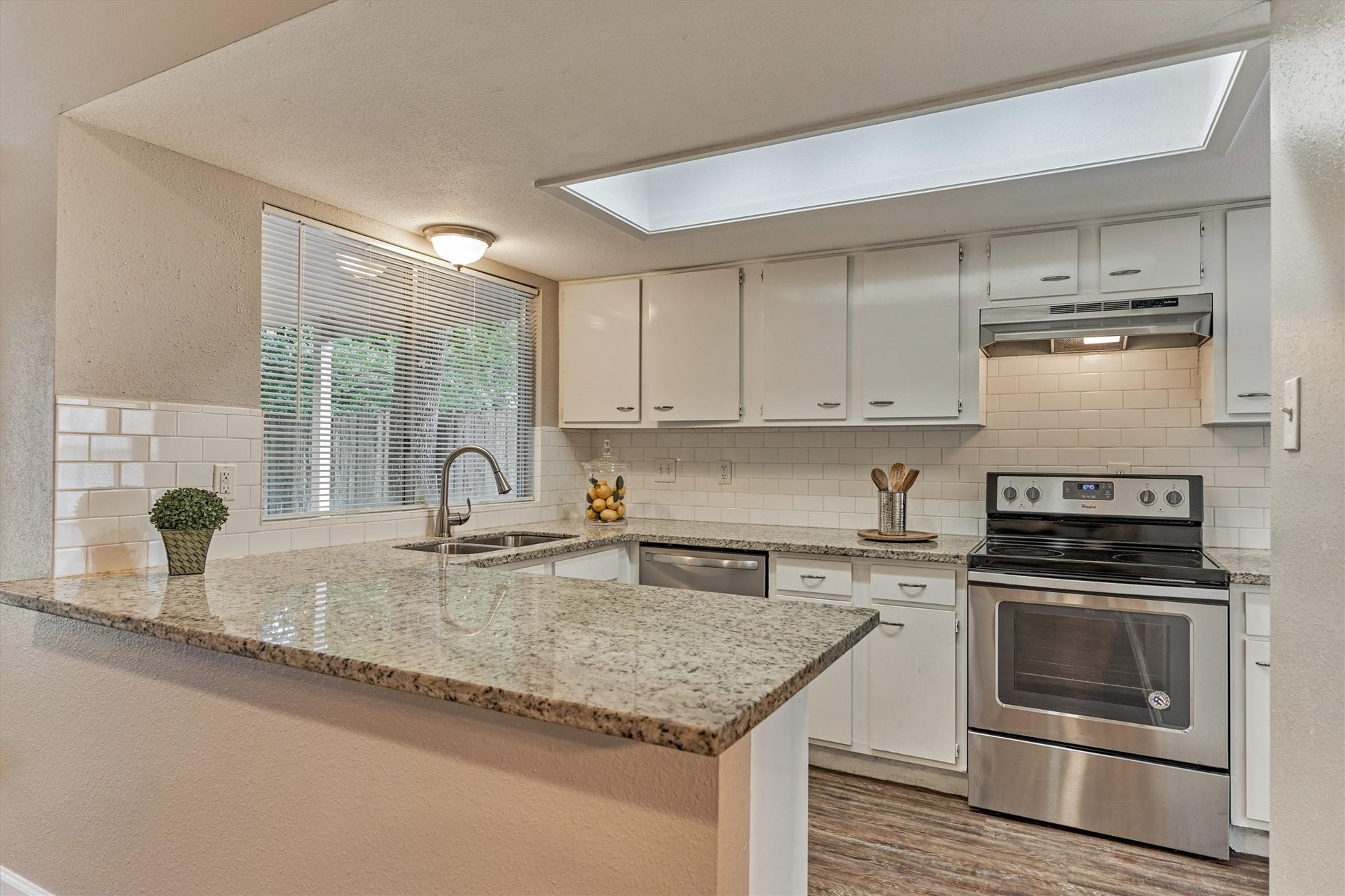 26 W Broken Oak Court, The Woodlands, TX 77381 Kitchen updates include granite counter tops, stainless steel appliances and, subway tile backsplash.