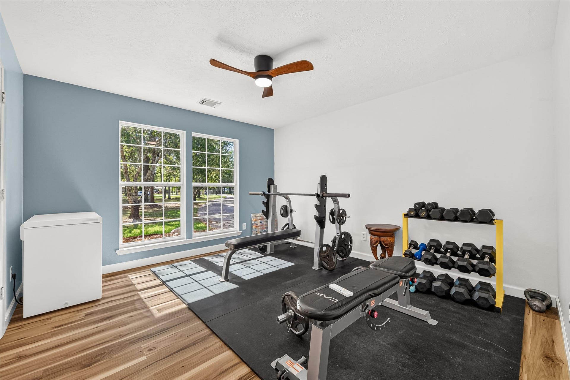 Spacious secondary bedroom with large windows providing plenty of natural light and ample room for a variety of uses.