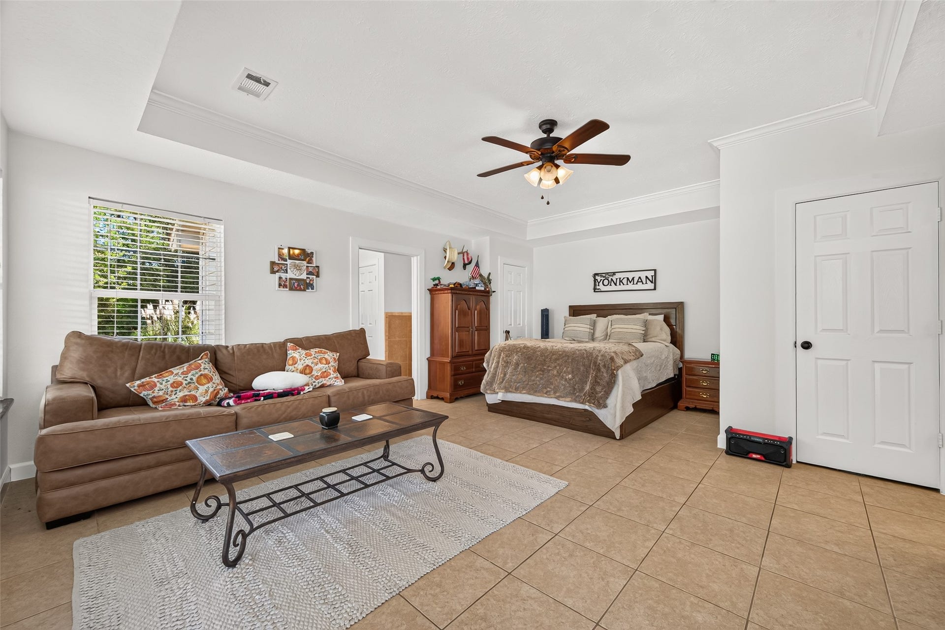 Guest Suite Living & Sleeping Area  Spacious open-concept layout with a dedicated living area, bedroom space and private bath access.