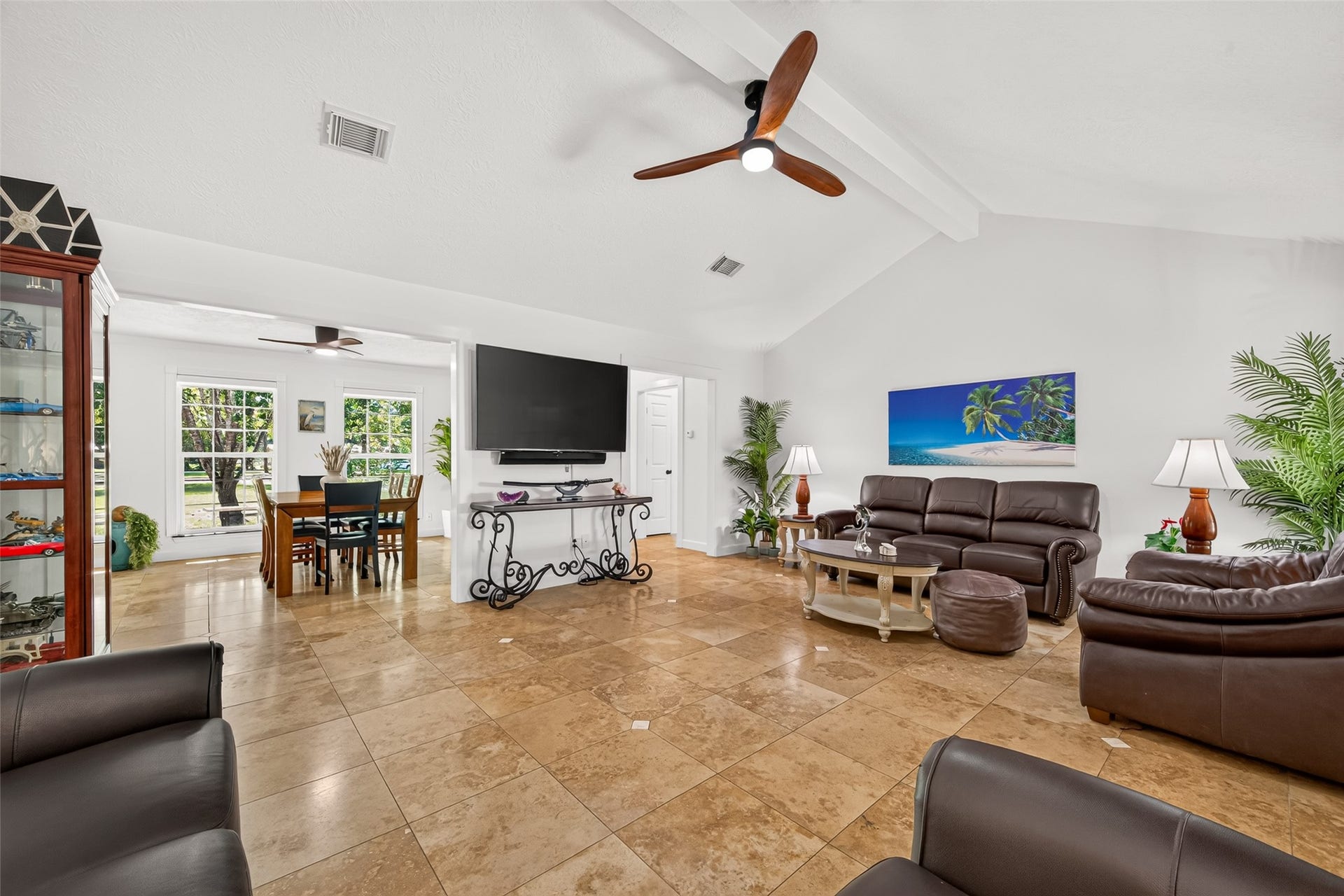 Open and spacious main living area with vaulted ceilings and a seamless flow into the adjoining dining area.