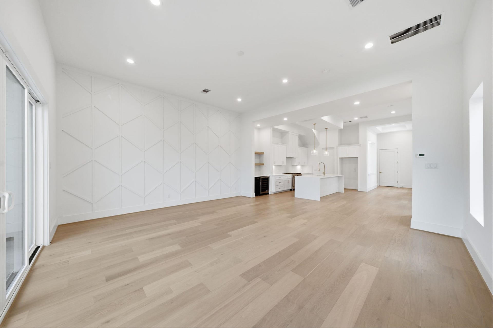 Another view from the dining area of soaring ceiling ceilings and natural light.