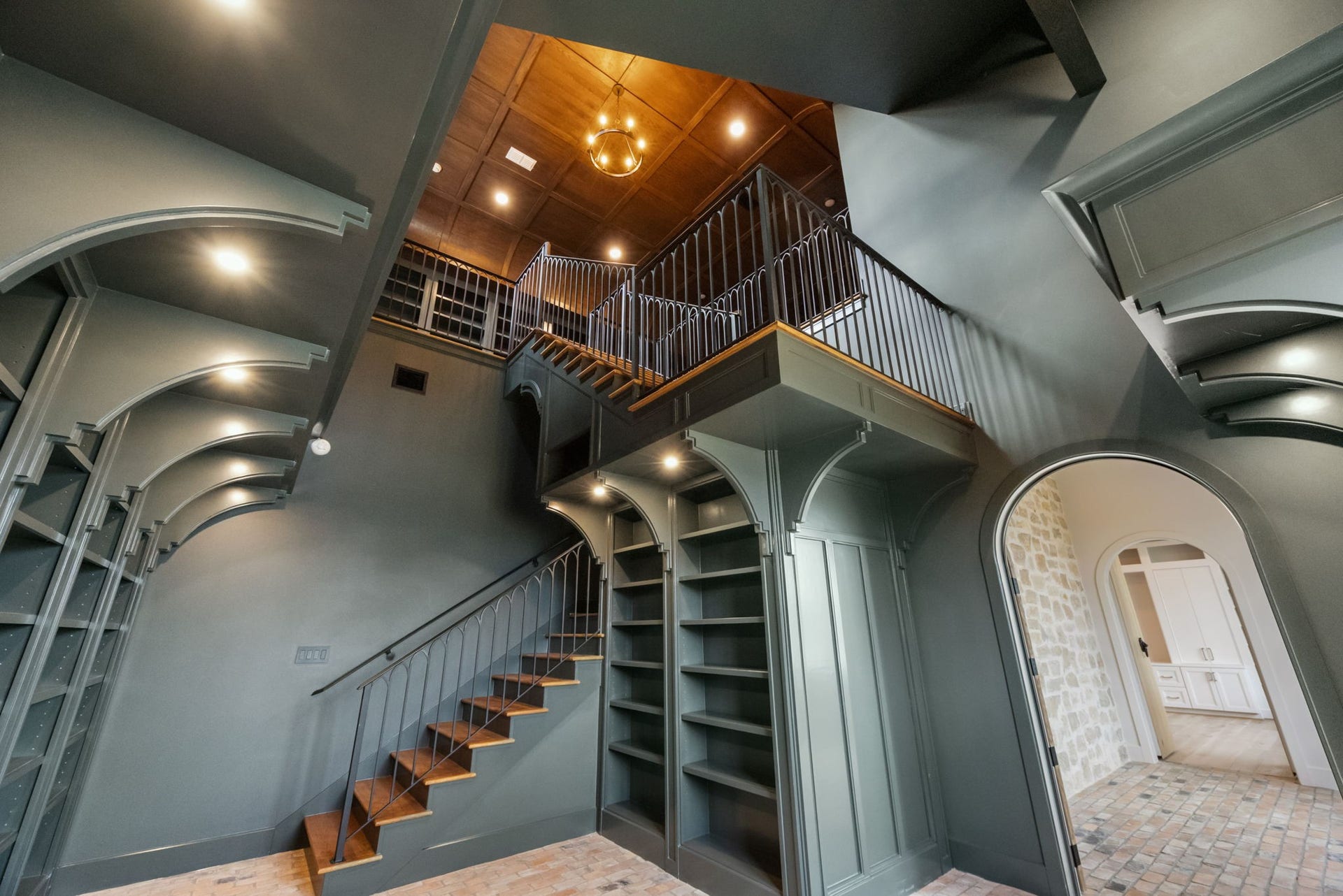 4233 Two Gun Way, Katy, TX 77494 Dramatic view of built-in and staircase and ceiling in library.