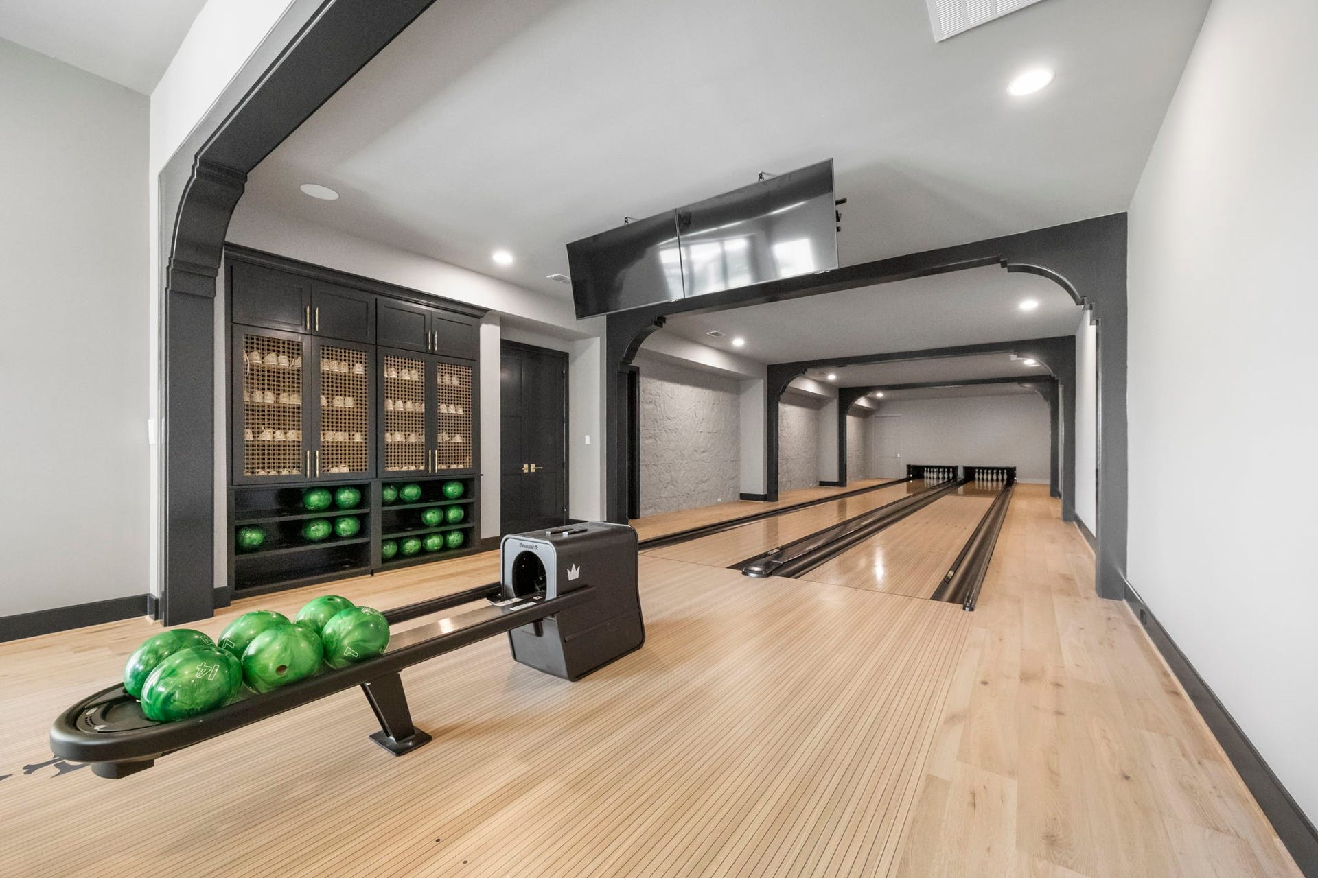 4233 Two Gun Way, Katy, TX 77494 Brunswick 2 lane bowling alley with shoe and ball storage to the left.