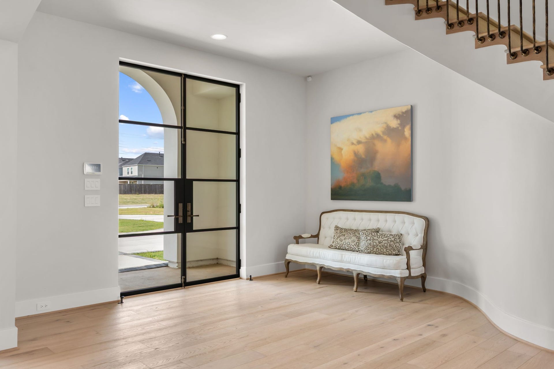 4233 Two Gun Way, Katy, TX 77494 View of entry foyer with large custom iron and glass front doors and sitting area.