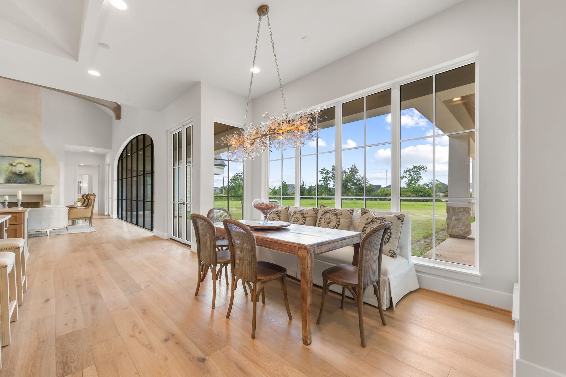 4233 Two Gun Way, Katy, TX 77494 Large breakfast room/informal dining room with wonderful crystal chandelier and sweeping views of rear loggia and back yard.