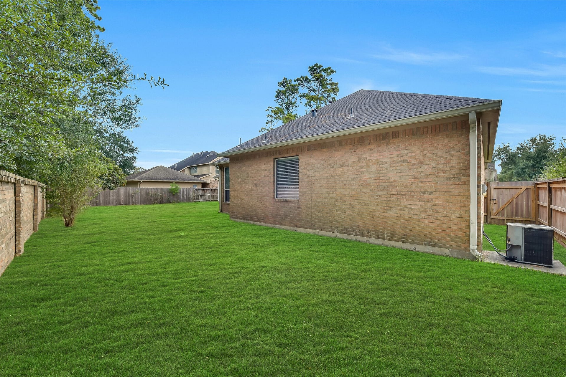 8407 Alyssa Gardens Lane, Humble, TX 77396 Highlighting the home's incredible lot size, this expansive backyard easily fits a garden and play area with a swing-set or trampolineall while leaving generous main yard space reserved for a future pool.