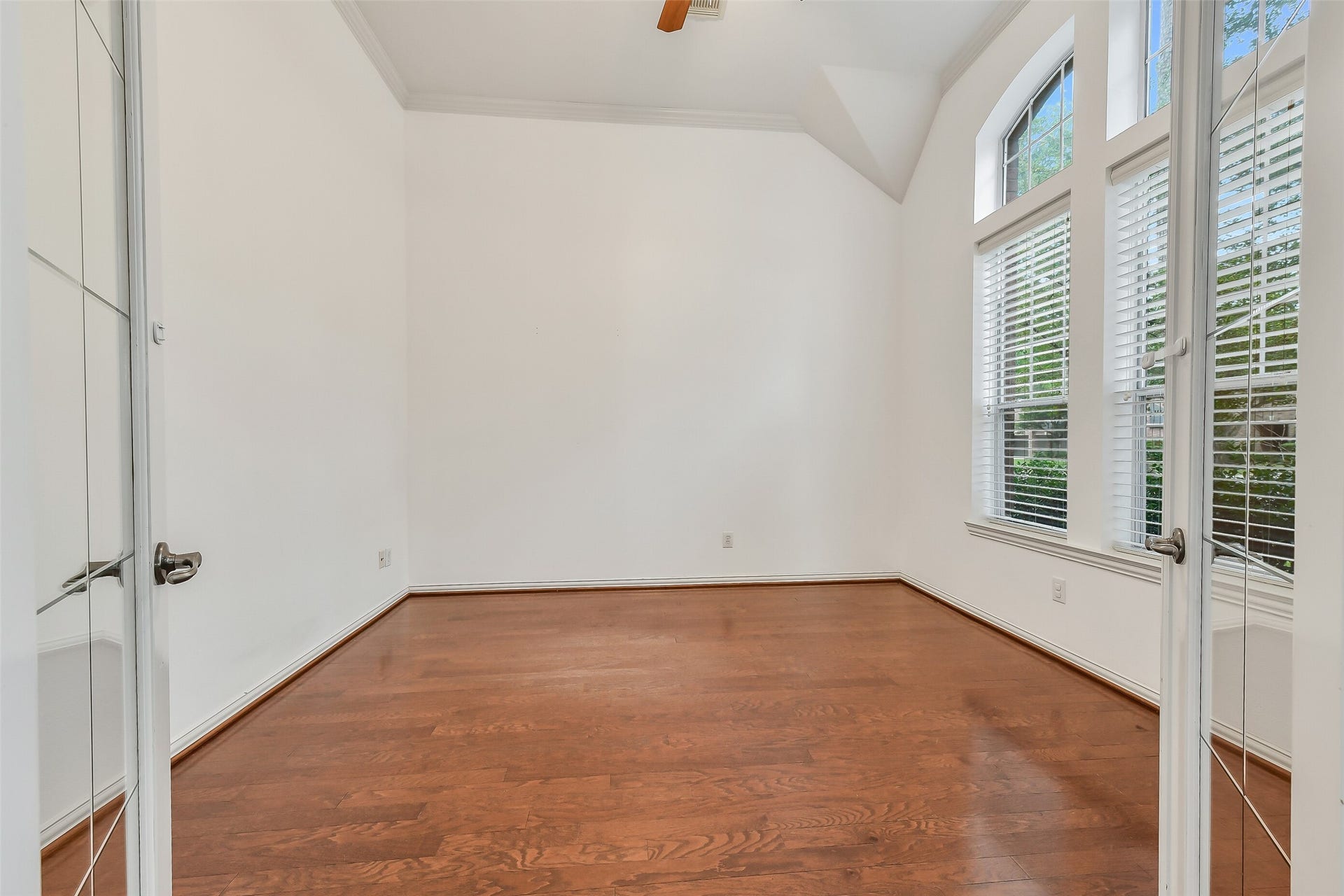 8407 Alyssa Gardens Lane, Humble, TX 77396 French doors provide privacy to this first-floor home office overlooking the front yard.