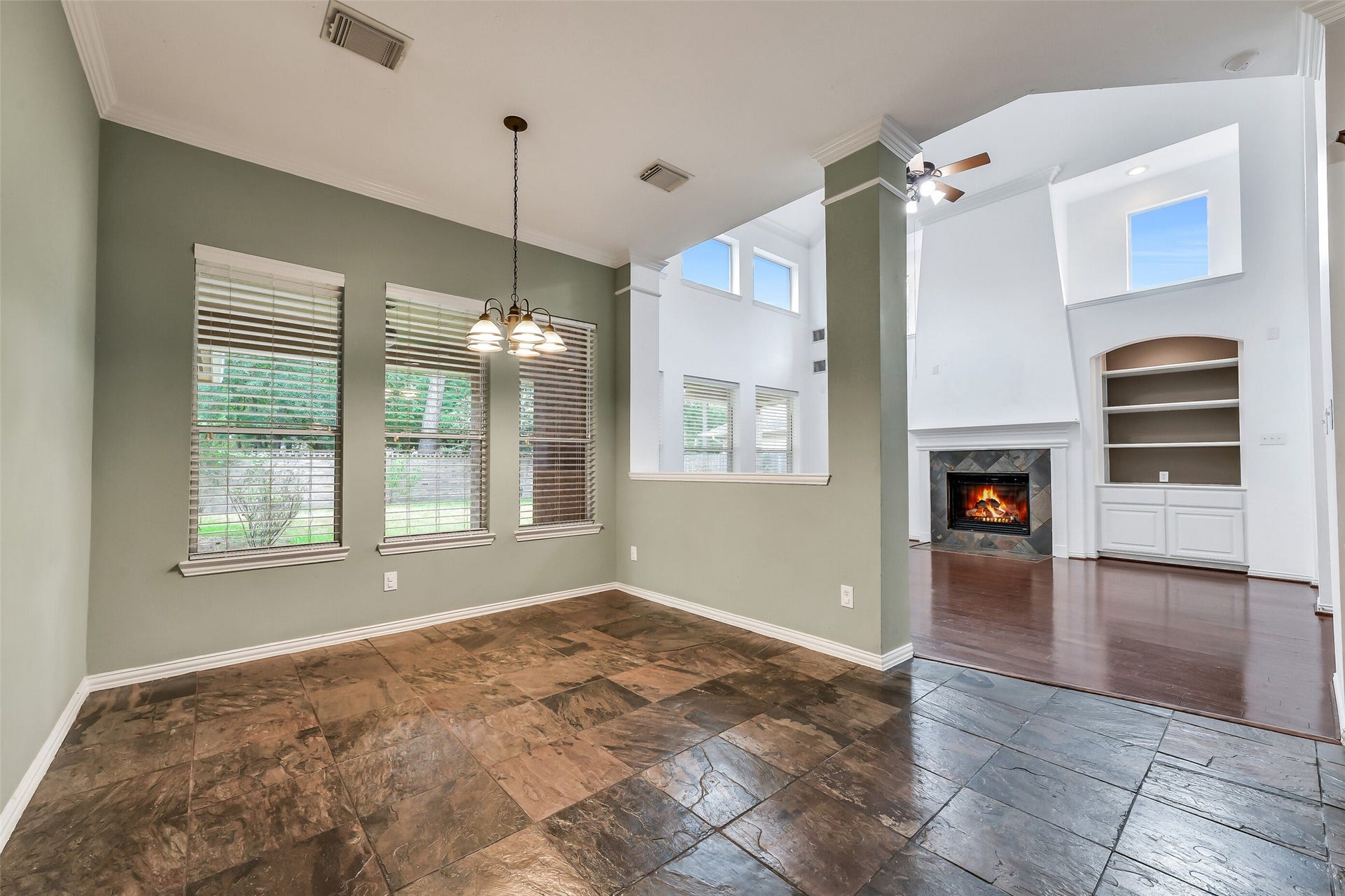 8407 Alyssa Gardens Lane, Humble, TX 77396 This view highlights the kitchen's stainless steel appliances, extra island storage, and an adjacent breakfast nook with pleasant views of the backyard.