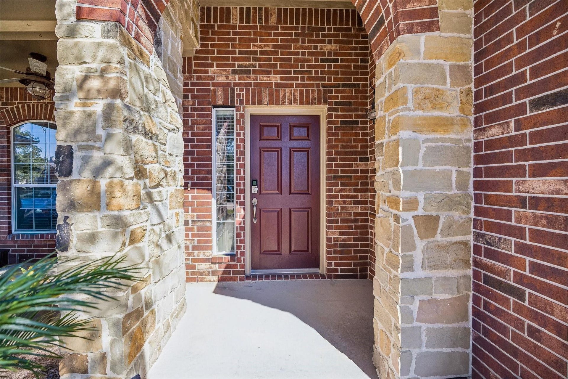 13918 Cypress Creek Bank Drive, Cypress, TX 77429 A covered front porch and beautiful wood-tone door create a warm welcome for guests. The arched entry and natural stone accents add character before you even step inside.