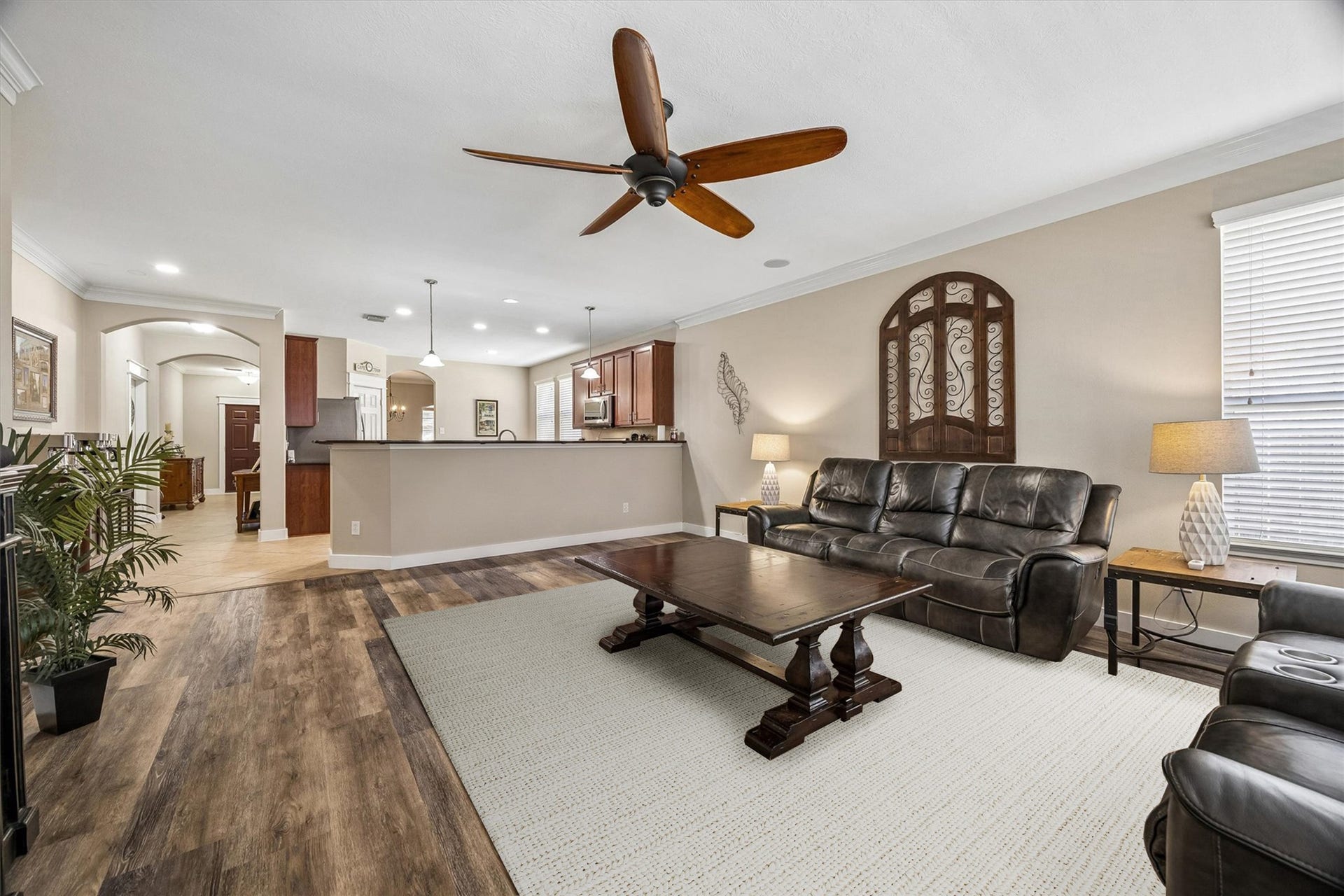 13918 Cypress Creek Bank Drive, Cypress, TX 77429 Another view of the family room highlights its generous proportions and open connection to the surrounding living areas. Natural light, neutral walls, and wood-look flooring create a welcoming space that's easy to make your own.