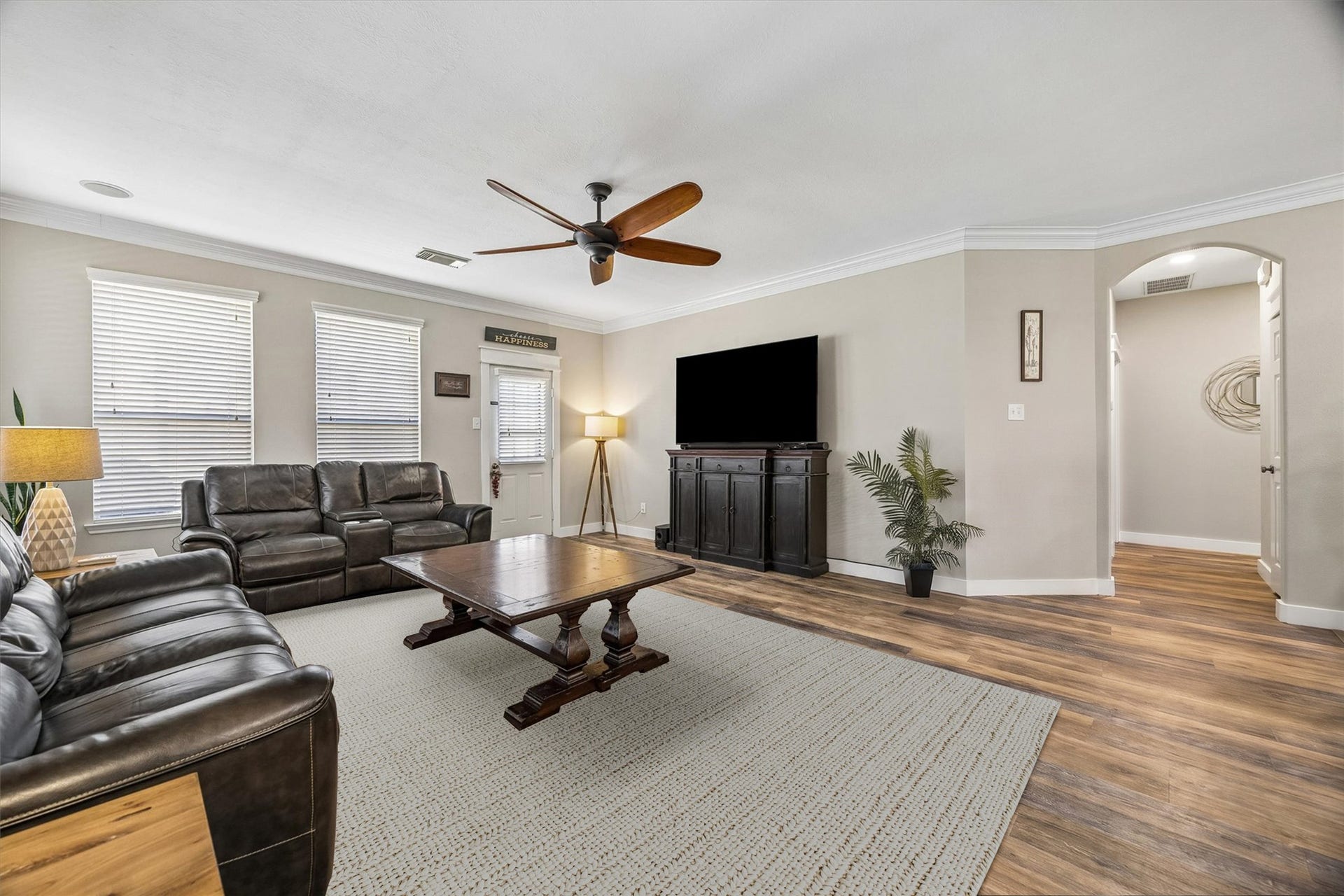 13918 Cypress Creek Bank Drive, Cypress, TX 77429 A bright and inviting family room with large windows, warm flooring, and a layout that makes furniture placement easy. Whether you're hosting friends or enjoying a quiet evening, this space feels right at home.