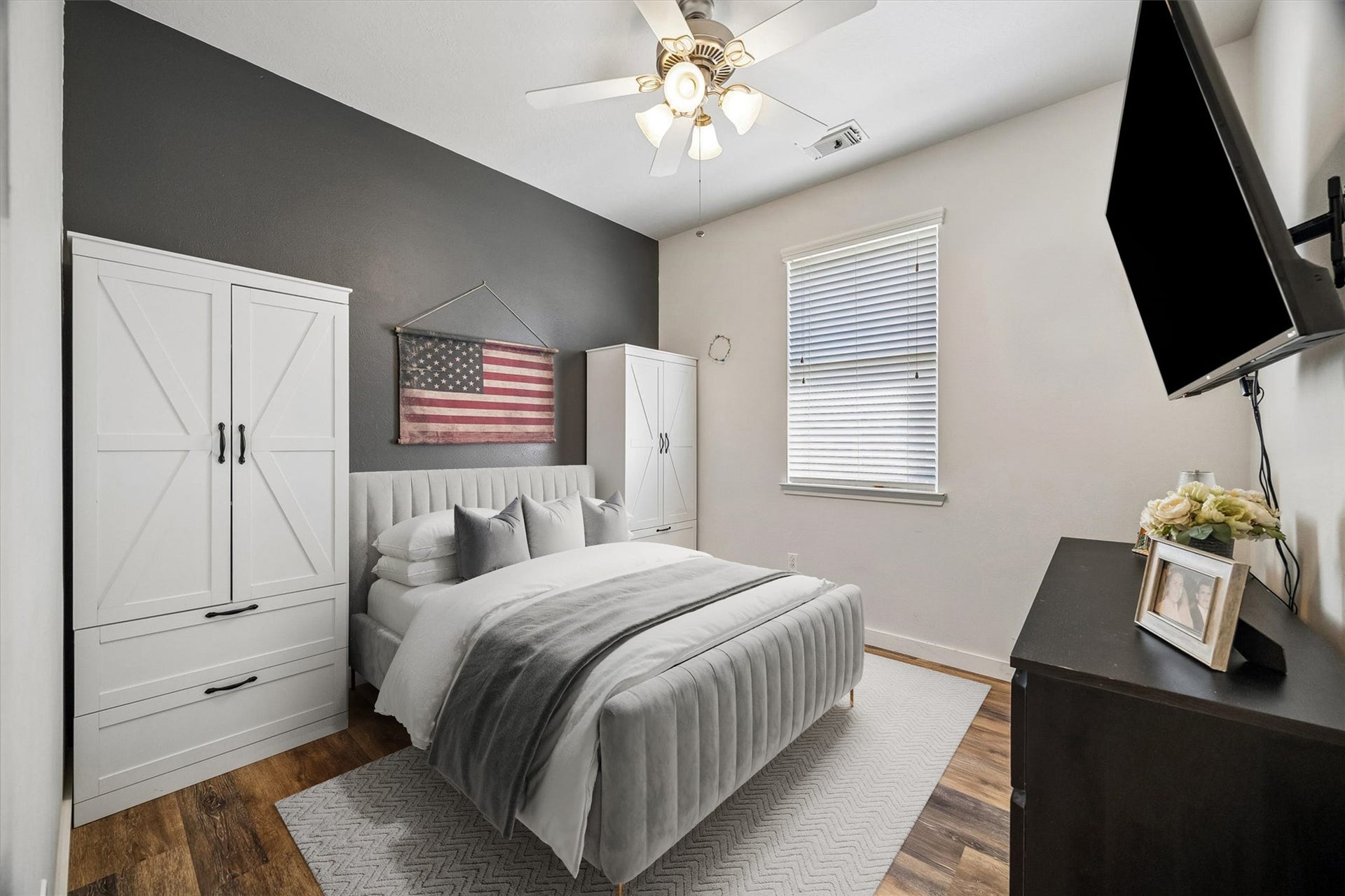 13918 Cypress Creek Bank Drive, Cypress, TX 77429 This secondary bedroom features wood-look flooring, a ceiling fan, and a neutral color palette. A comfortable space that can easily accommodate guests or serve as a home office.