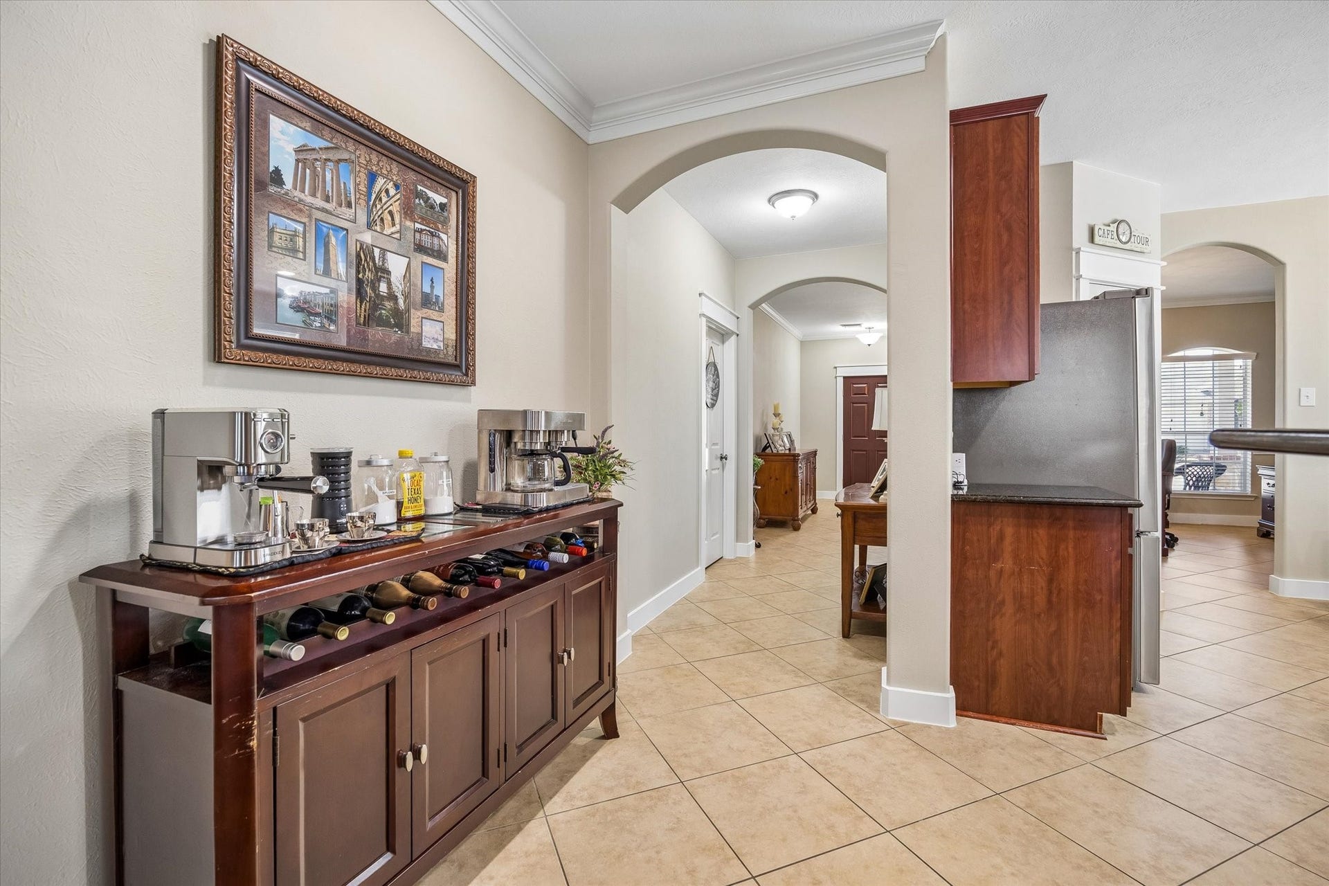 13918 Cypress Creek Bank Drive, Cypress, TX 77429 An elegant arched opening connects the dining area to the kitchen, creating a natural flow for everyday living and entertaining. The space offers room for a buffet or console table, perfect for serving guests or displaying favorite pieces.