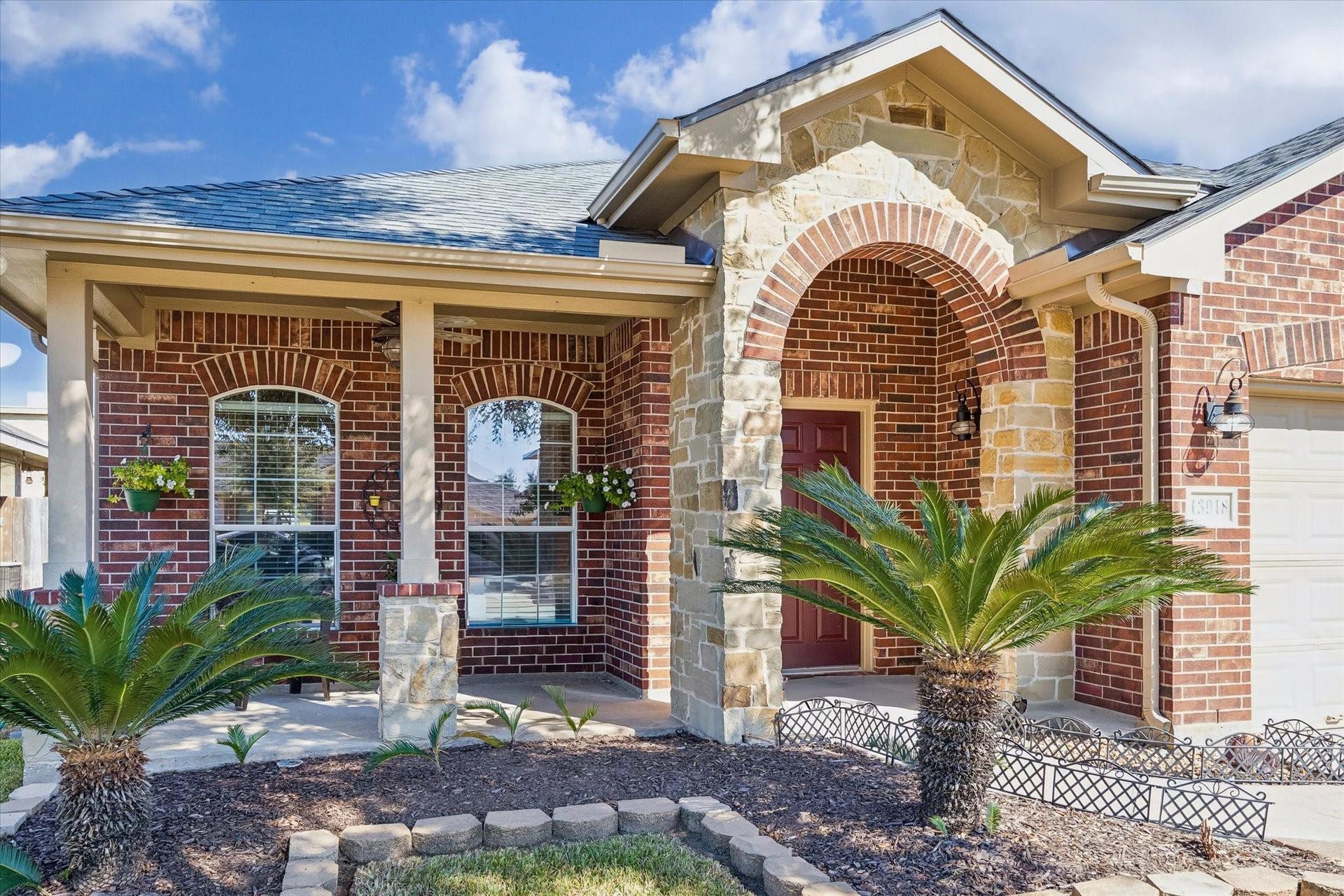 13918 Cypress Creek Bank Drive, Cypress, TX 77429 Brick-and-stone detailing, an arched entry, and thoughtfully maintained landscaping give this home plenty of character. A welcoming introduction to the comfortable, single-story living found inside.