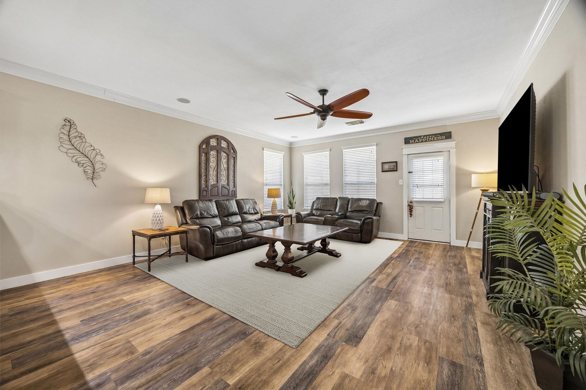 13918 Cypress Creek Bank Drive, Cypress, TX 77429 The family room offers a comfortable place to unwind, with beautiful wood-look flooring, a ceiling fan, and plenty of natural light. There's room for generous seating without sacrificing the open, airy feel.