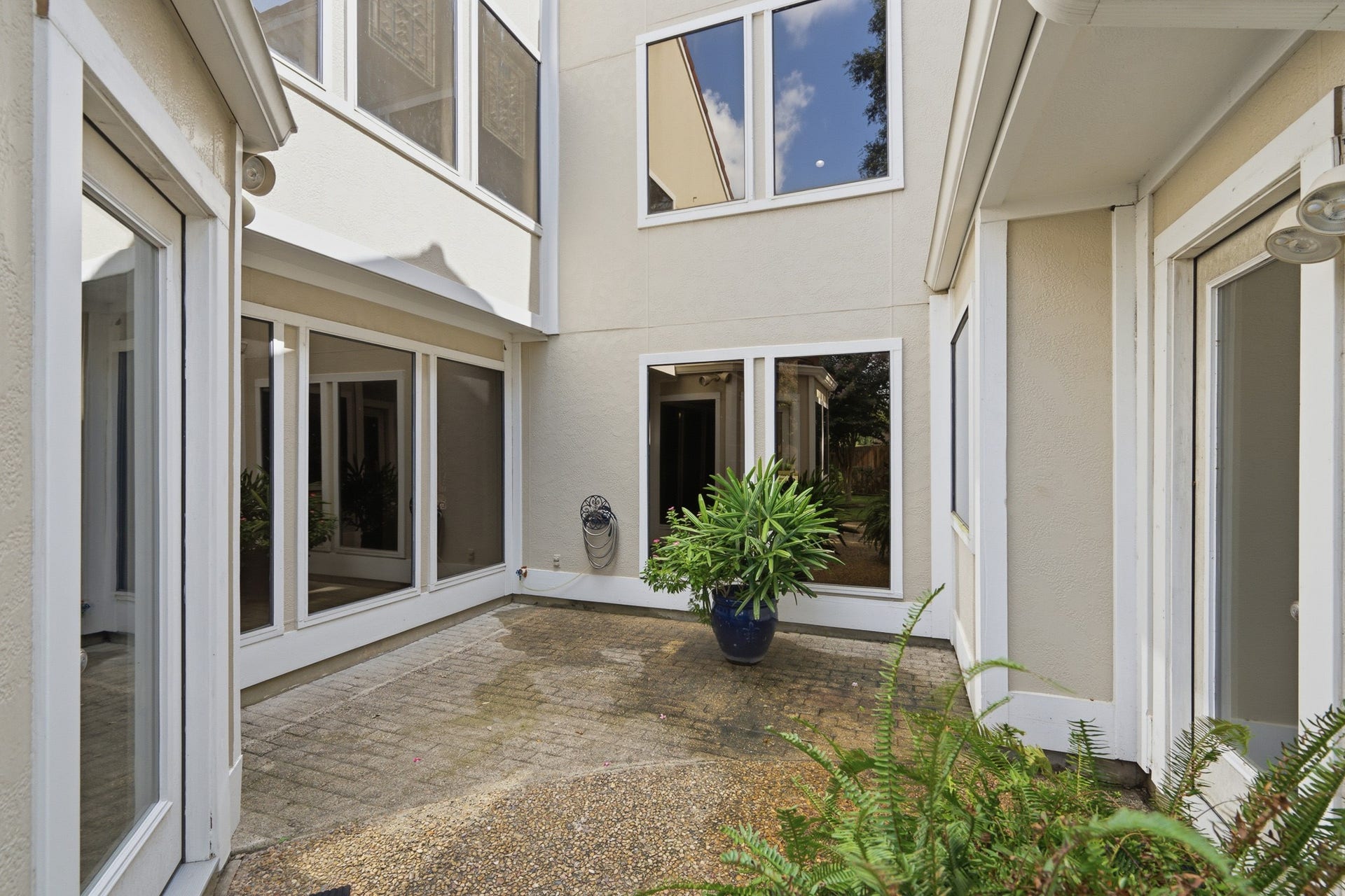 Courtyard patio provides a comfortable setting for relaxing or entertaining outdoors.