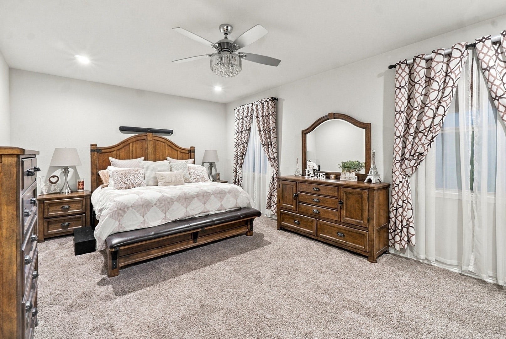 18042 Atwood Mill Drive, New Caney, TX 77357 Another view of the primary suite highlights its generous proportions and natural light from multiple windows.